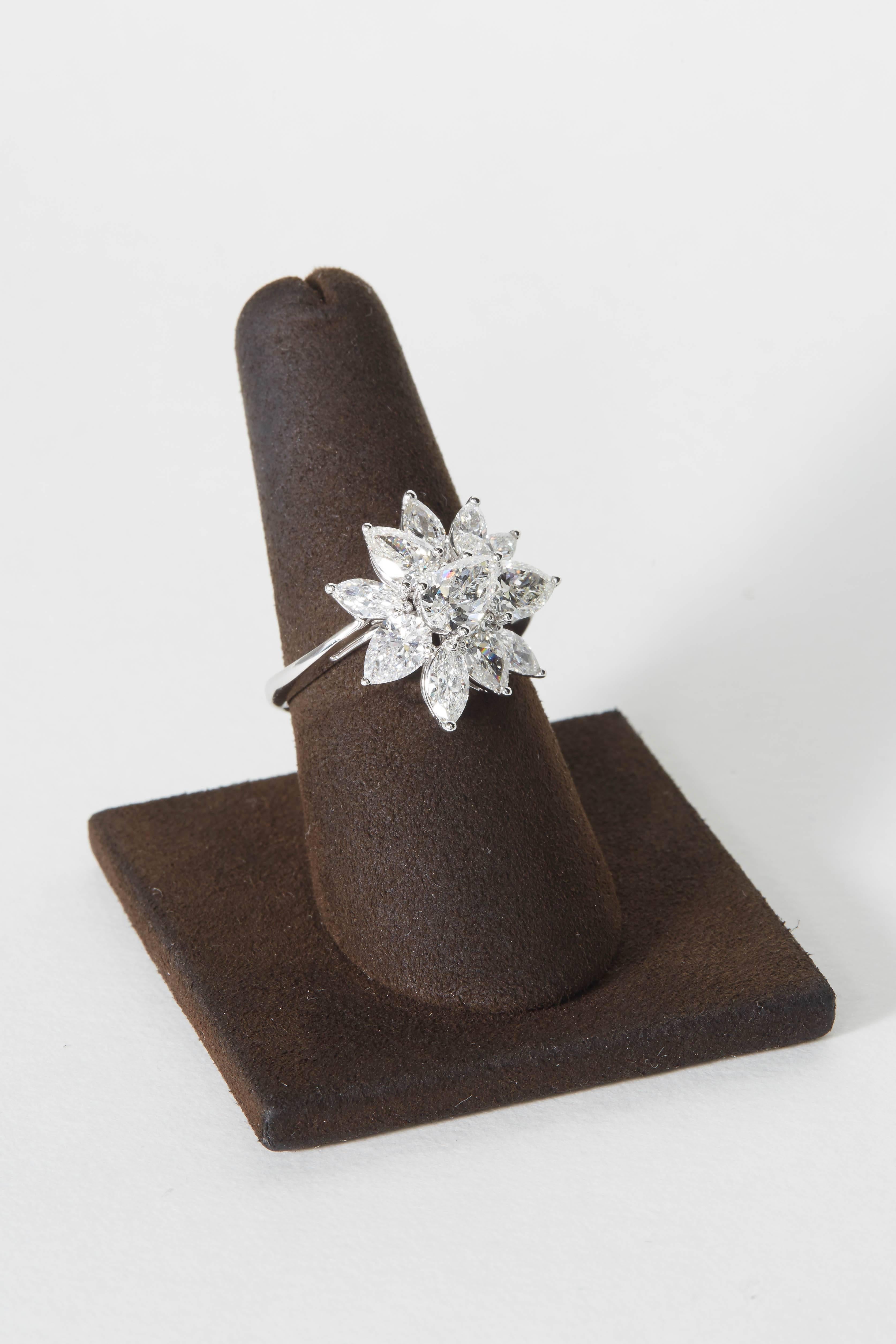 
A beautiful design, so much sparkle!!

This cluster ring can be worn with a pair of cluster earrings or to complete a wreathe necklace and earring set. It is stunning on its own as well!

3.75 carats of white VS pear shape and marquise diamonds set