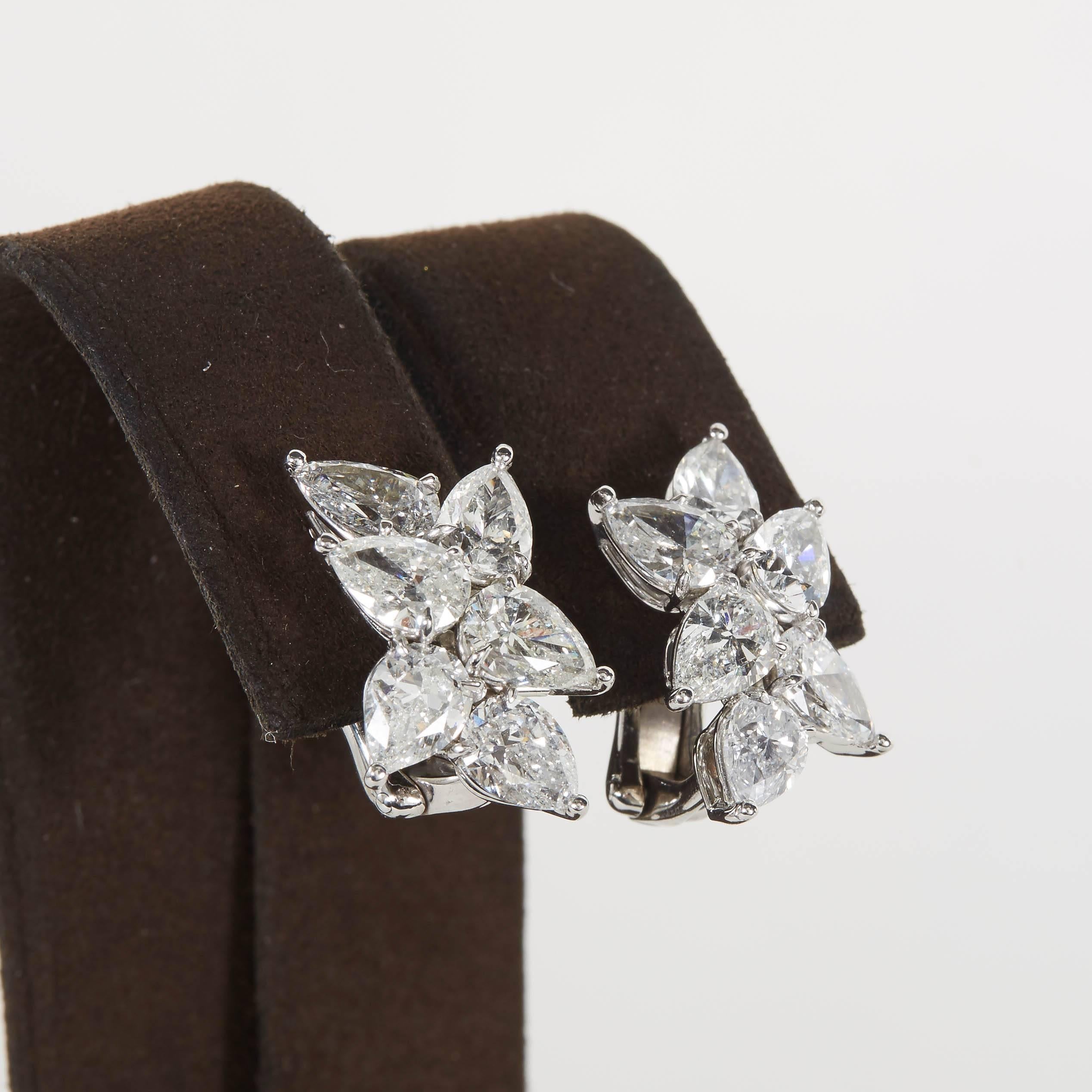 

12 white pear shape diamonds weighing 6.68 carats set in platinum. 

Approximately 3/4 inches from the highest to lowest points.

Handmade in New York 