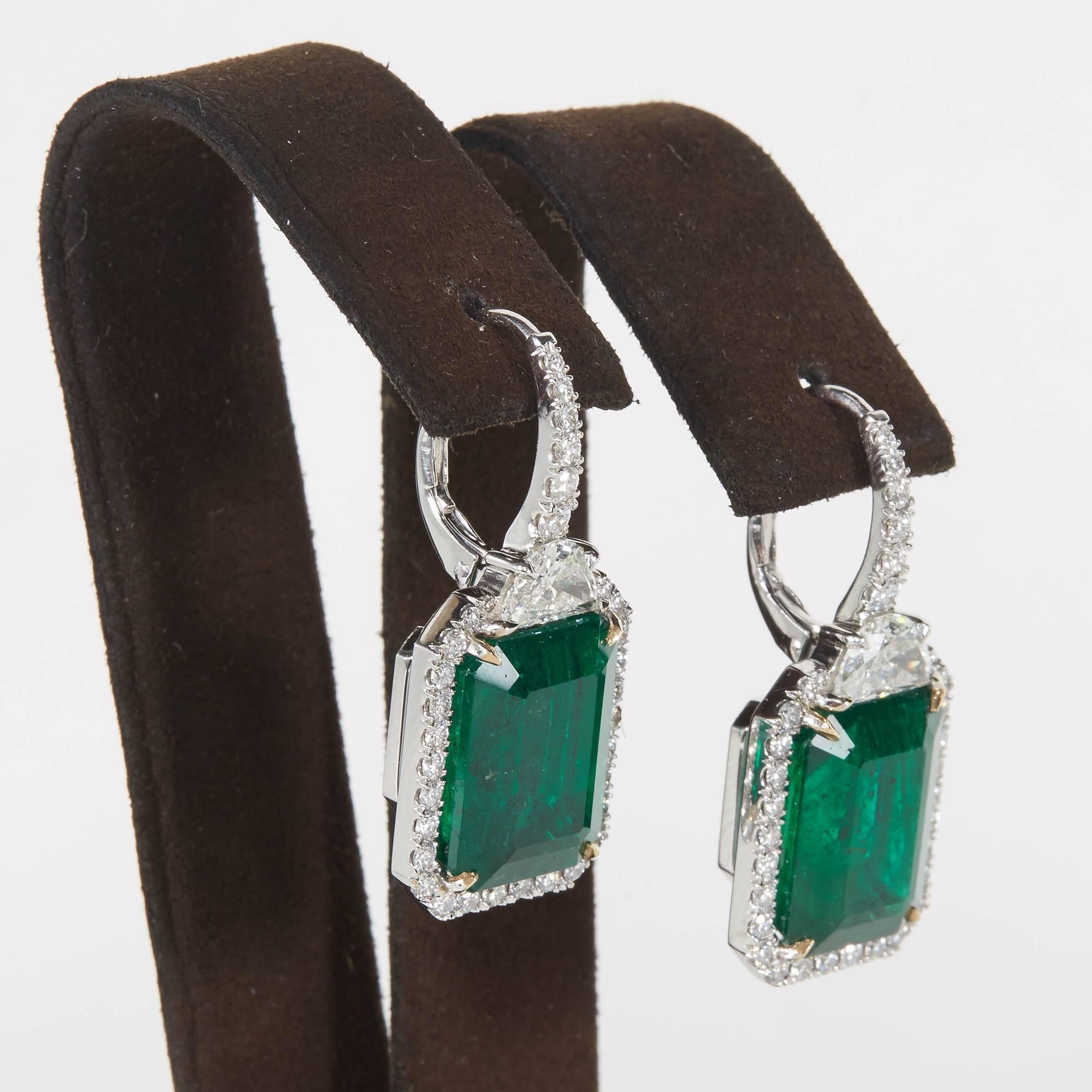 

Beautiful rich Green Emeralds pop in this comfortable and wearable earring. 

19.77 carats of Fine Green Emerald
2.47 carats of white diamonds
18k white gold 

1.26 inches long and just under half an inch wide, approximately. 

Custom made in New