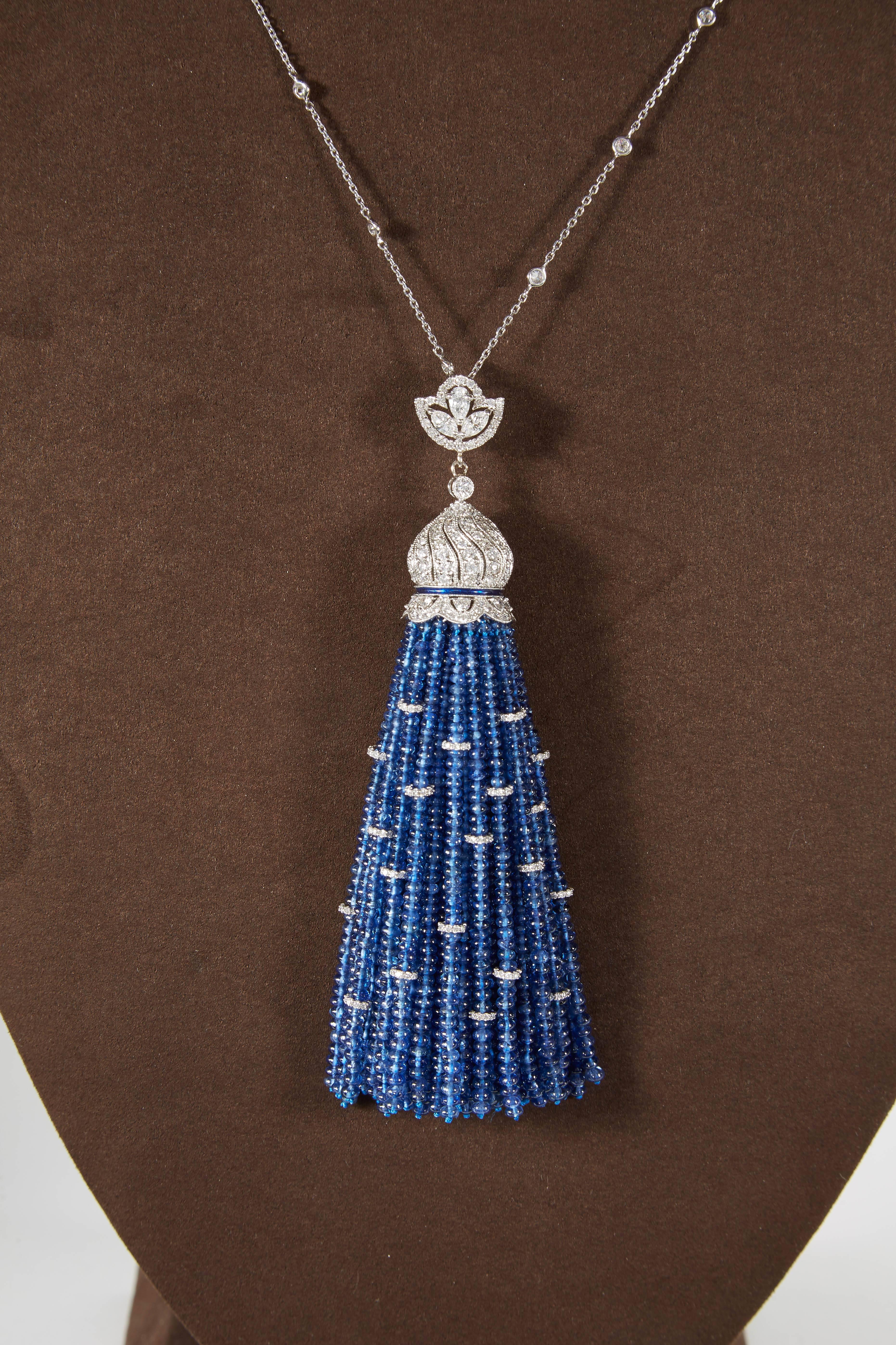 

A fantastic piece!

Over 250 carats of Fine Blue Sapphire, 7.85 carats of white round brilliant diamonds!

31 inch removable diamond by yard chain

The tassel pendant is approximately 4.25 inches long 

All set in 18k white gold. 

A fabulous