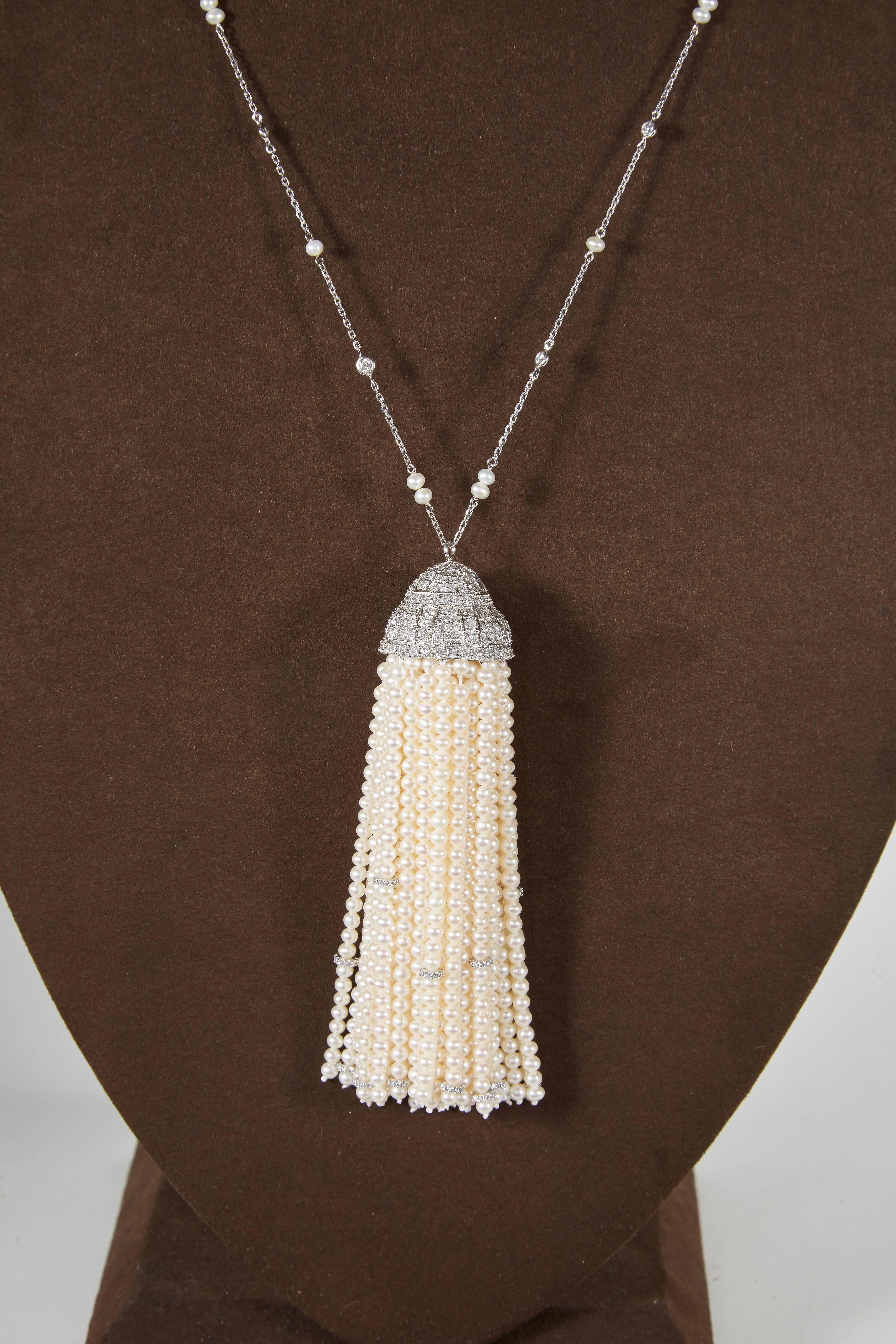 A fabulous piece! 

Pearl and diamond tassel hanging from a diamond by yard with pearl accents. 

6.76 carats of F/G VS diamonds -- 18k white gold 

The bottom and middle of the tassel has rings of diamonds to add extra sparkle to the tassel! 

32