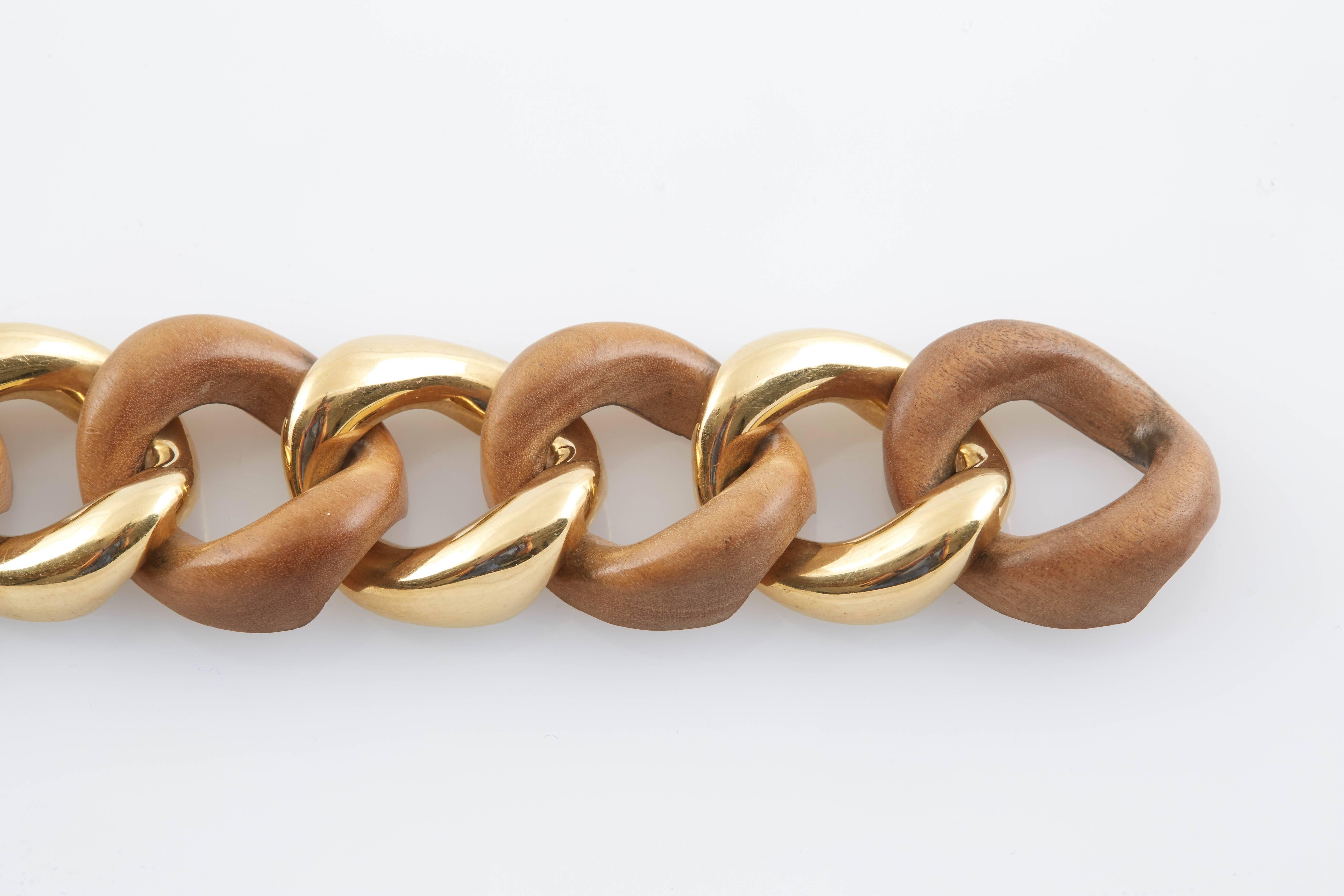 Large and Bold 18K Yellow gold and Wood link Bracelet by Seaman Schepps, signed and numbered in original presentation box.