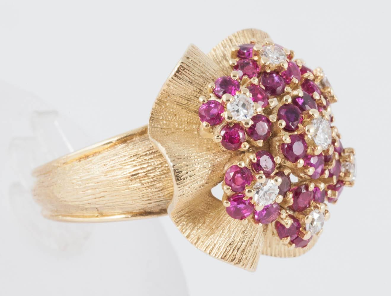 This 1960's dress ring is set with natural untreated Burma Rubies and Diamonds
Finger size O