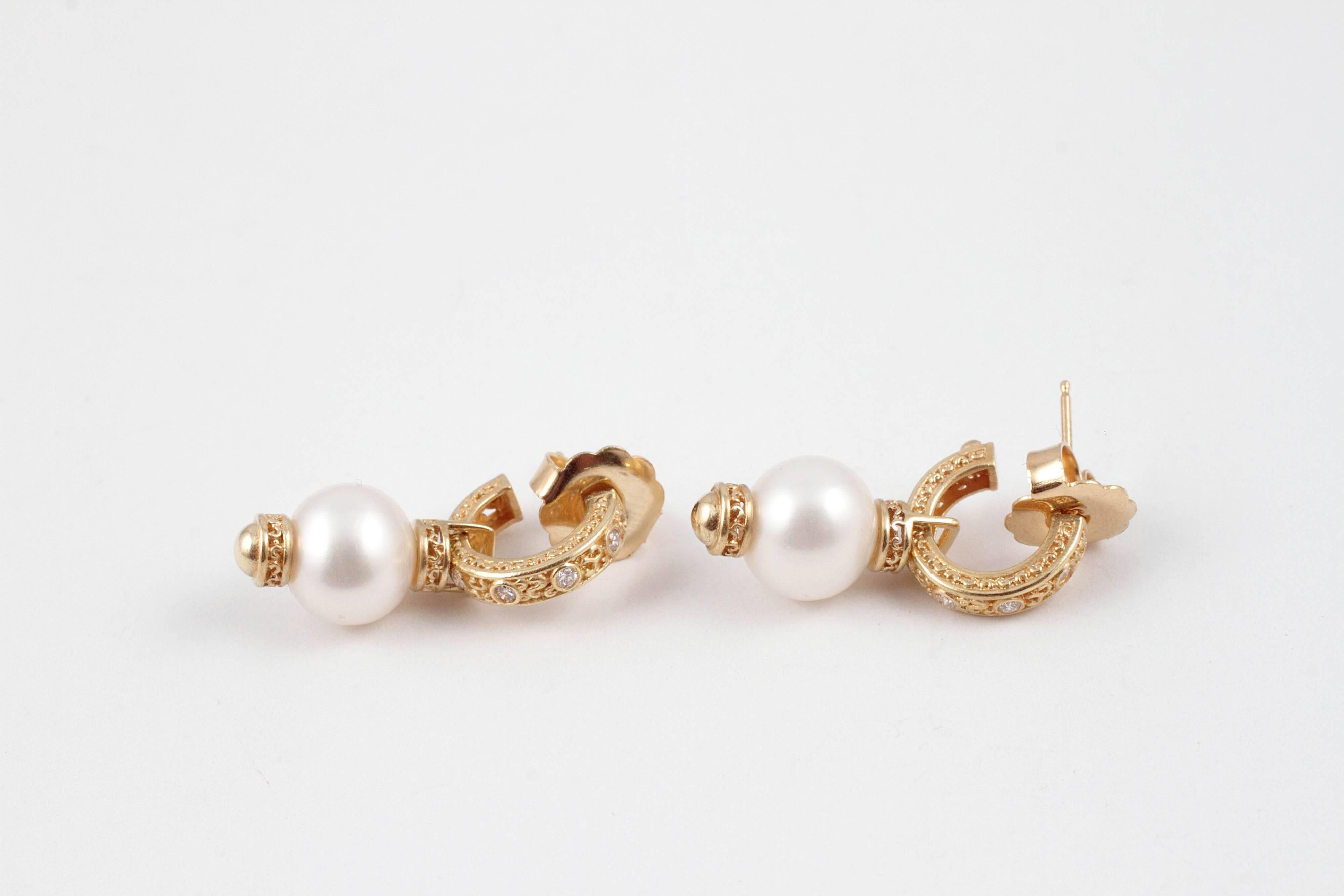 Dress them up for the evening or wear them with jeans and a vest!  They are in 18 karat yellow gold, with accent diamonds and 9.50 mm cultured pearls.  What a great look!