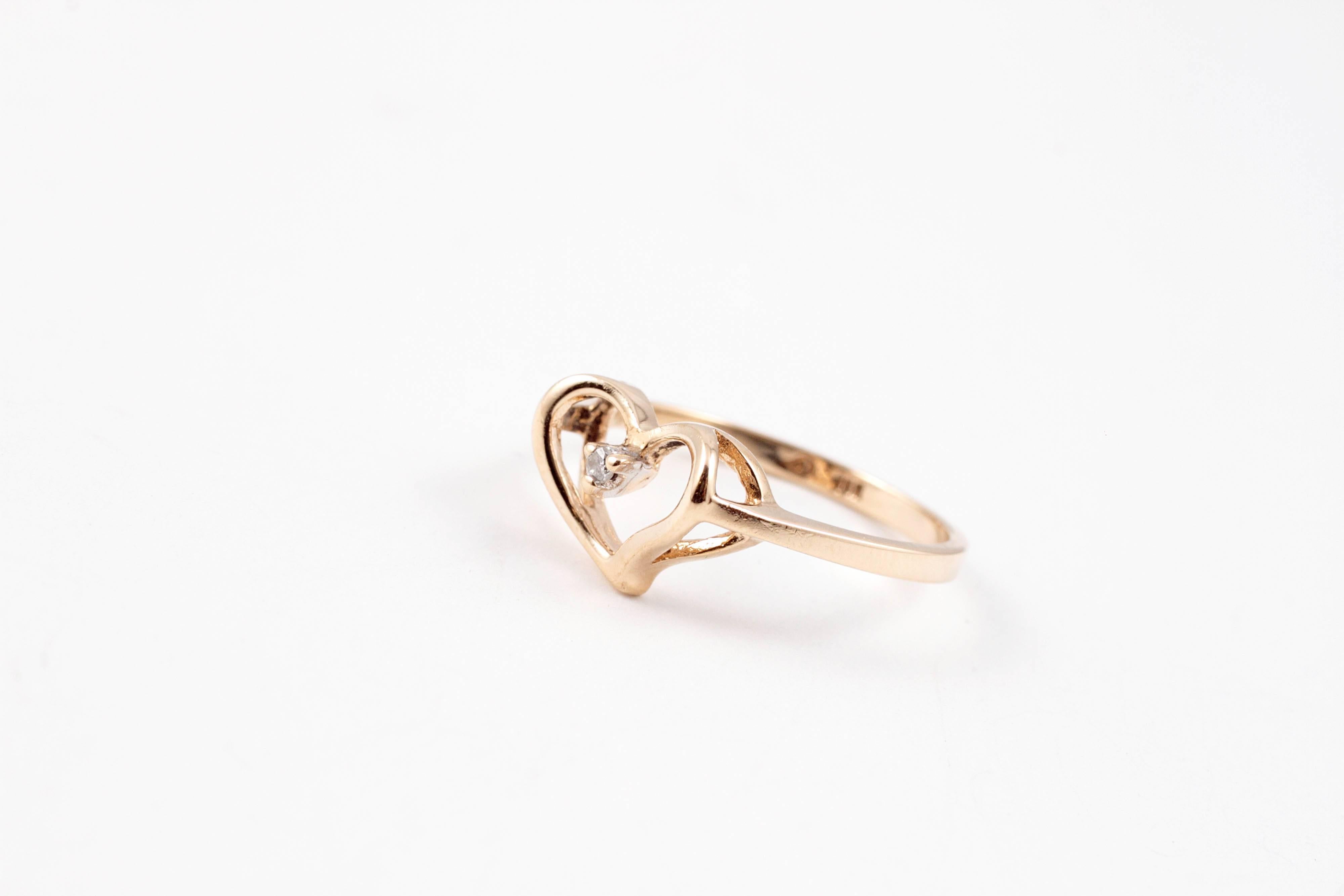 This is a timeless accessory, perfect for any young lady! Beautiful open heart in 10 karat yellow gold. 
 Size 5.75