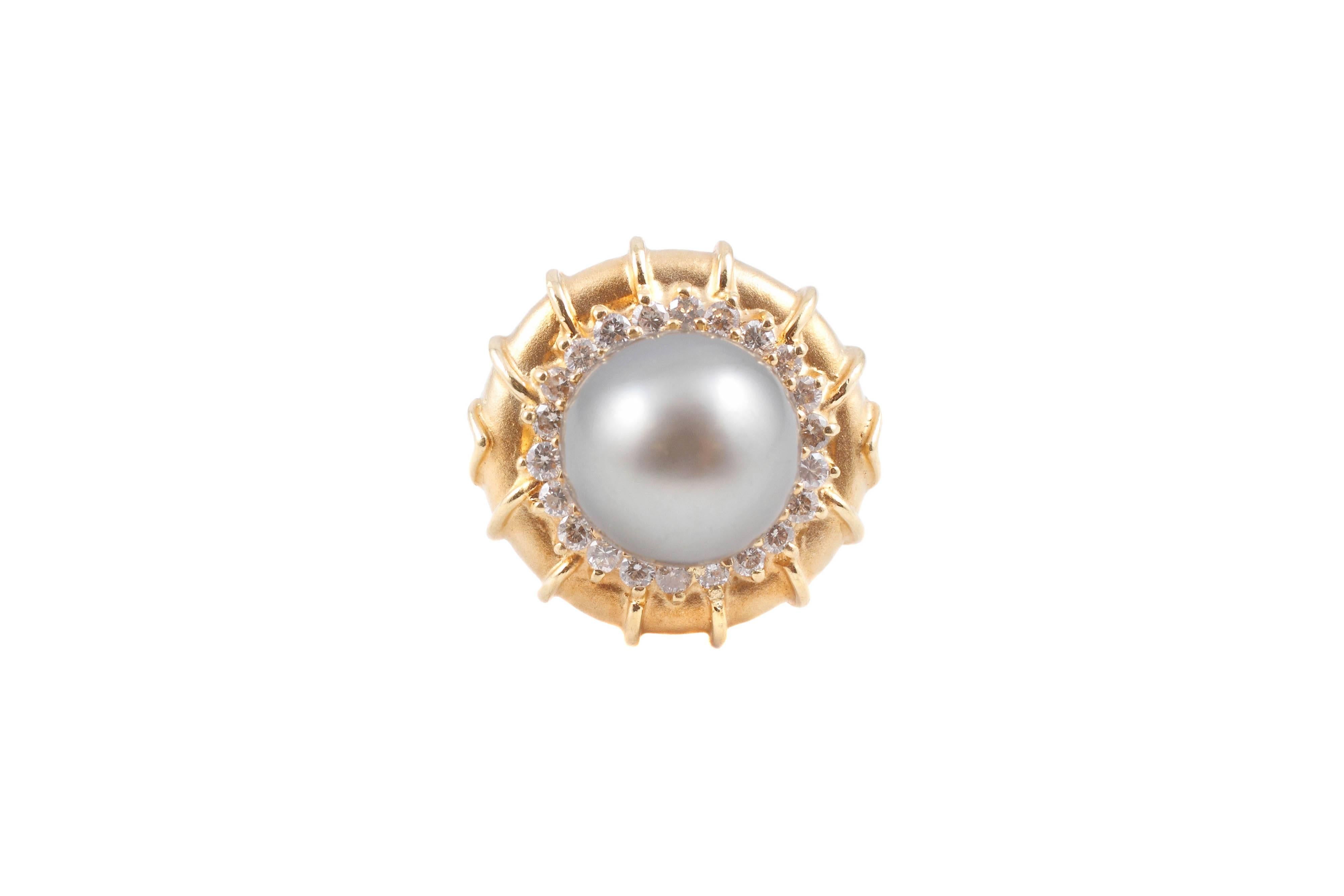Very unusual to see a natural color Tahitian cultured pearl in a yellow gold mounting!  18 karat yellow gold at that and encircled with diamonds!  in a size 5 3/4.  