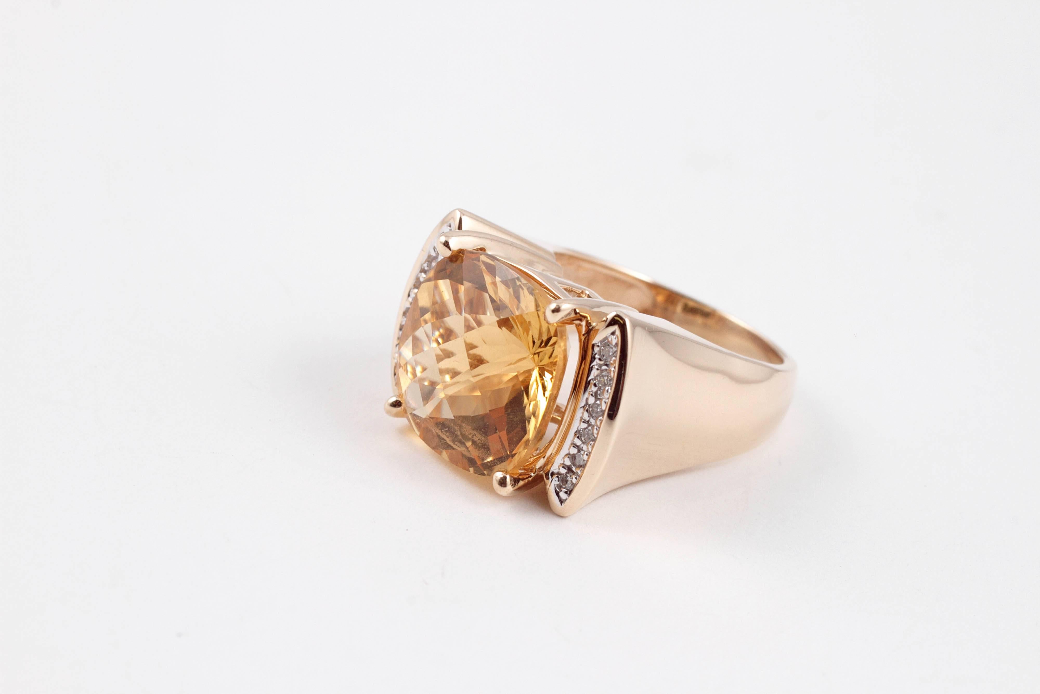 Bold and fancy!  in 14 karat yellow gold, this 11.00 ct citrine and diamond ring is a great look for either hand.  Size 7 1/2.