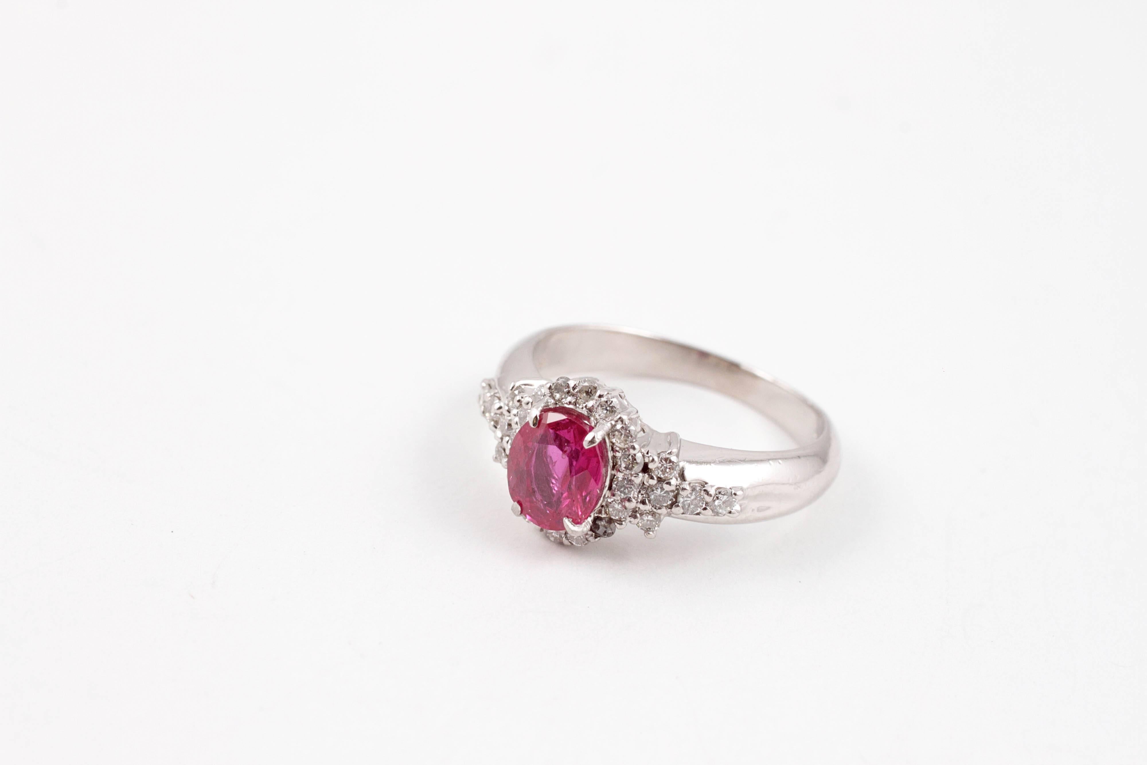 Composed in platinum, with a bright and shining 1.15 carat Burma ruby, flanked by 0.40 carats of diamonds.  

This ring is accompanied by Stone Group Labs Gemstone Identification and origin report stating the center stone to be 