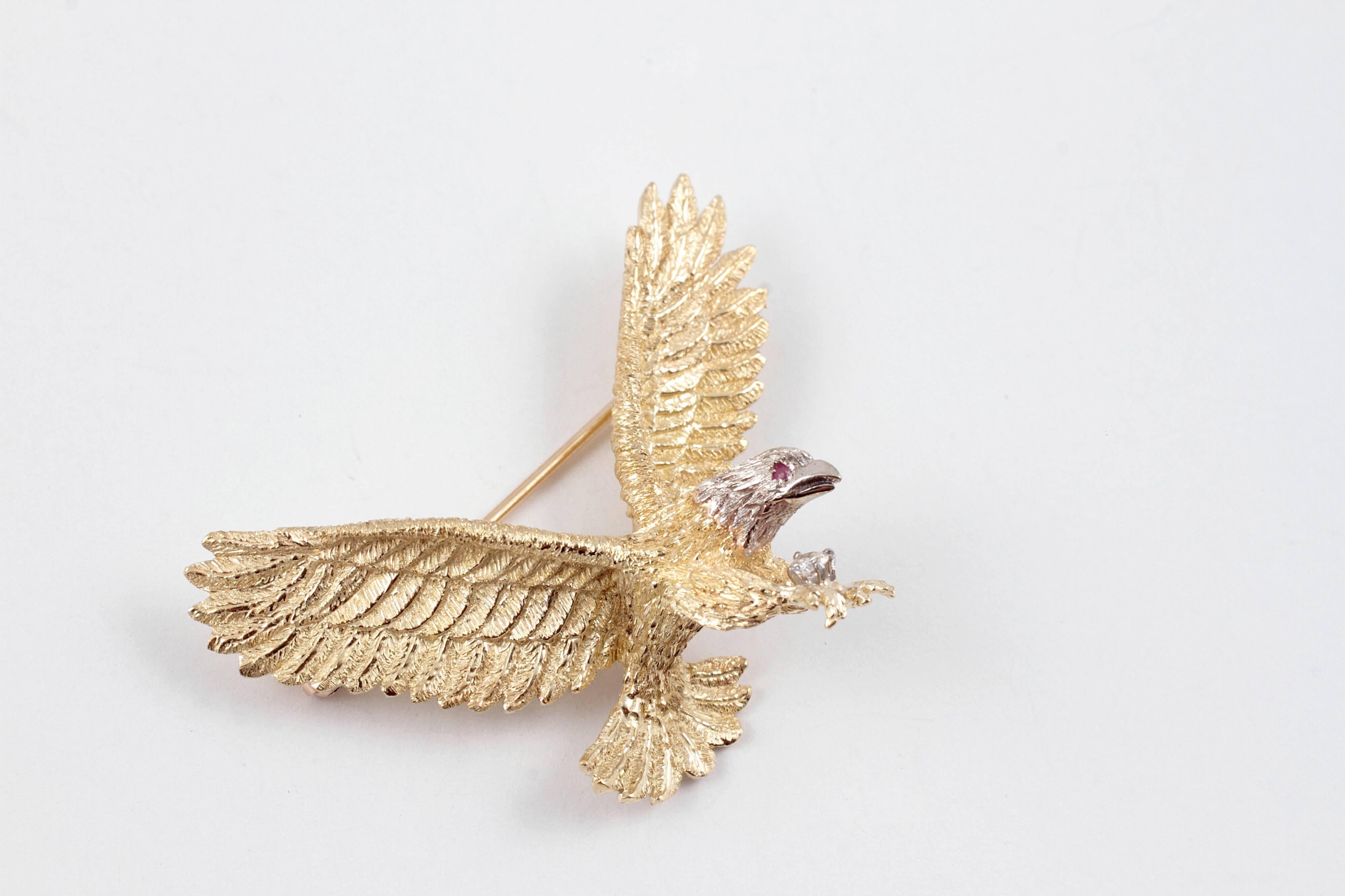 Stunning and Majestic! 18 karat two tone with an accent diamond, this Eagle brooch is sure to please the collector!  Measuring 1.75 inches wing tip to wing tip, secured with a straight pin clasp.