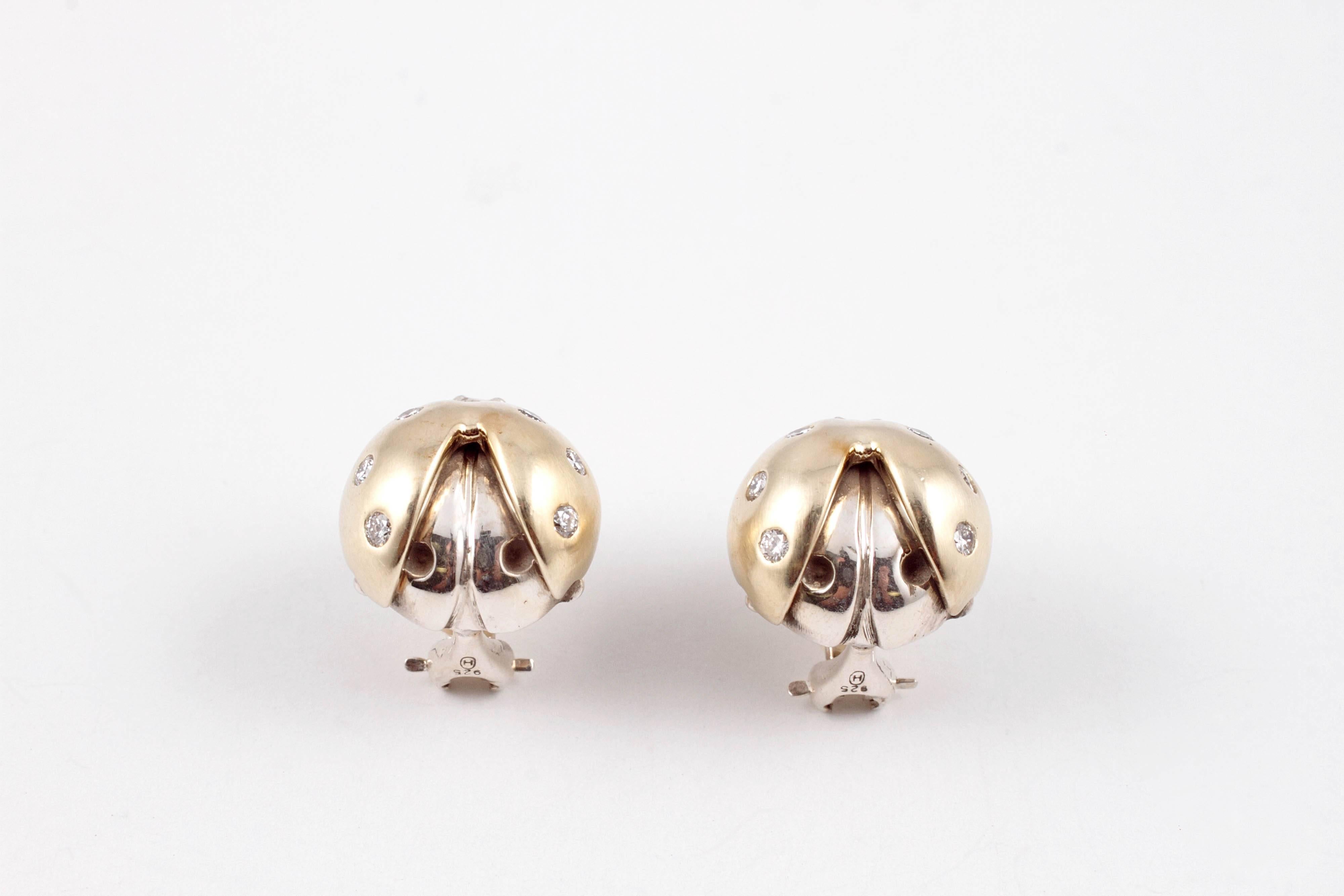 For the collector or the person who likes something a little out of the ordinary!  These darling ladybug earrings are composed of 18 karat yellow gold and sterling silver and are by Sarah Jane for Saint.