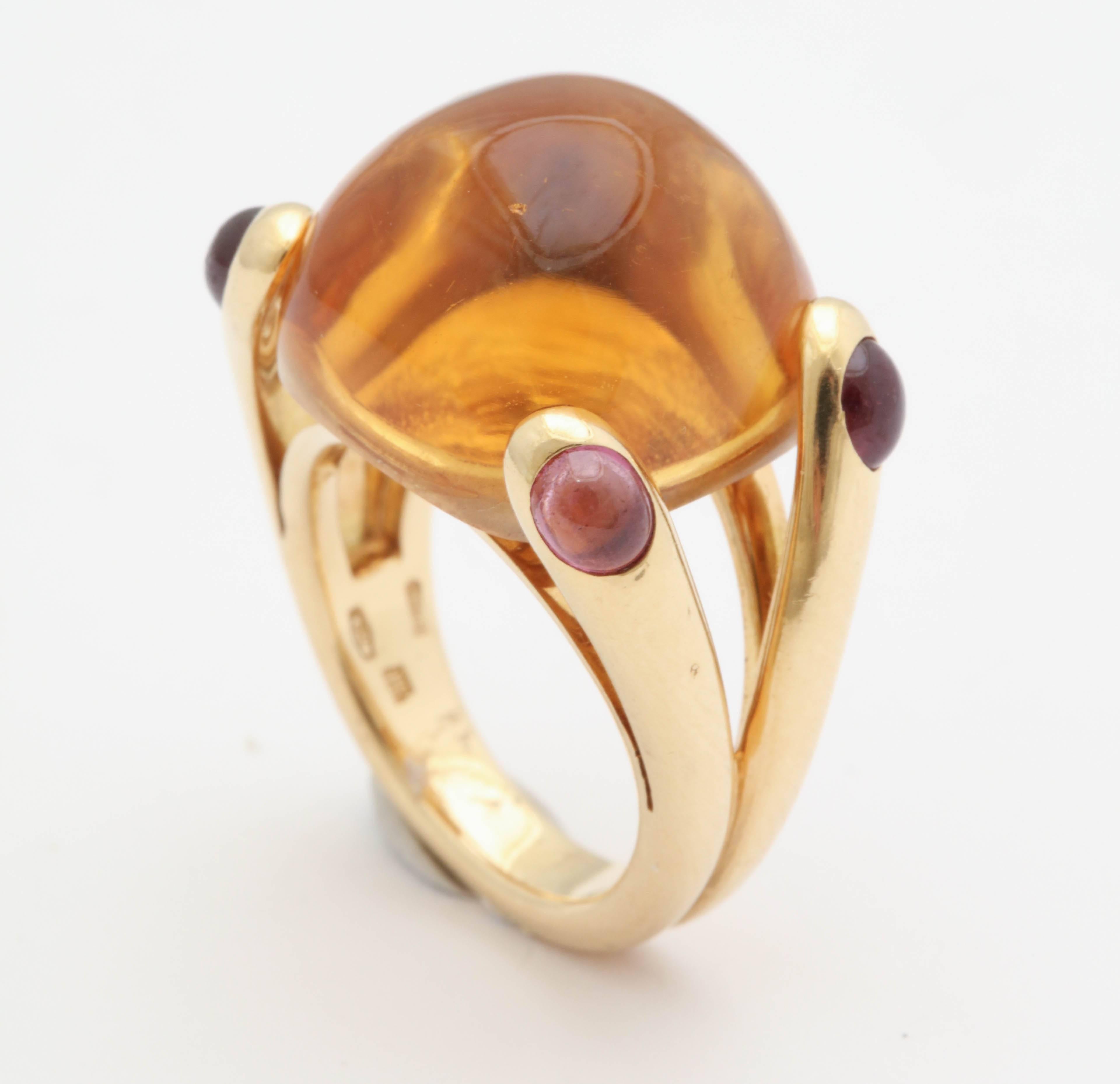 One Ladies Dome Ring Designed With A 15 Carat Honey Color Cabochon Citrine Stone. Ring Is Further Flanked With Four Cabochon Cut Pink Tourmalines. Current Ring Size 5 & 3/4 ,May Be Resized.Designed By Verdura In Italy In The 1980's.NOTE:These