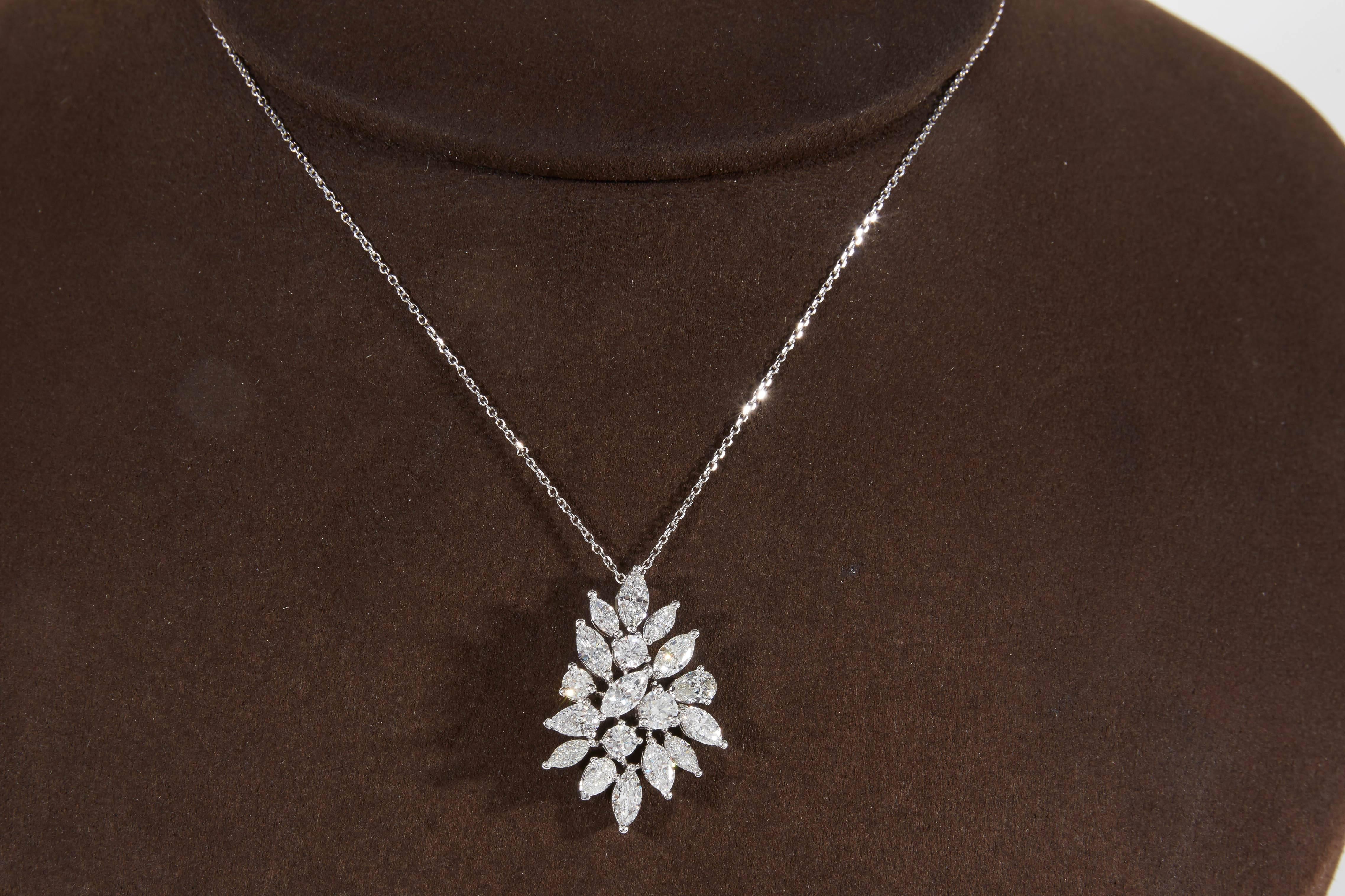 
A beautiful diamond cluster pendant that matches many of our earrings and wreathe necklaces on 1stDibs. 

2.55 carats of white VS marquise, pear and round brilliant cut diamonds set in white gold. 

This pendant also looks FABULOUS on its own.