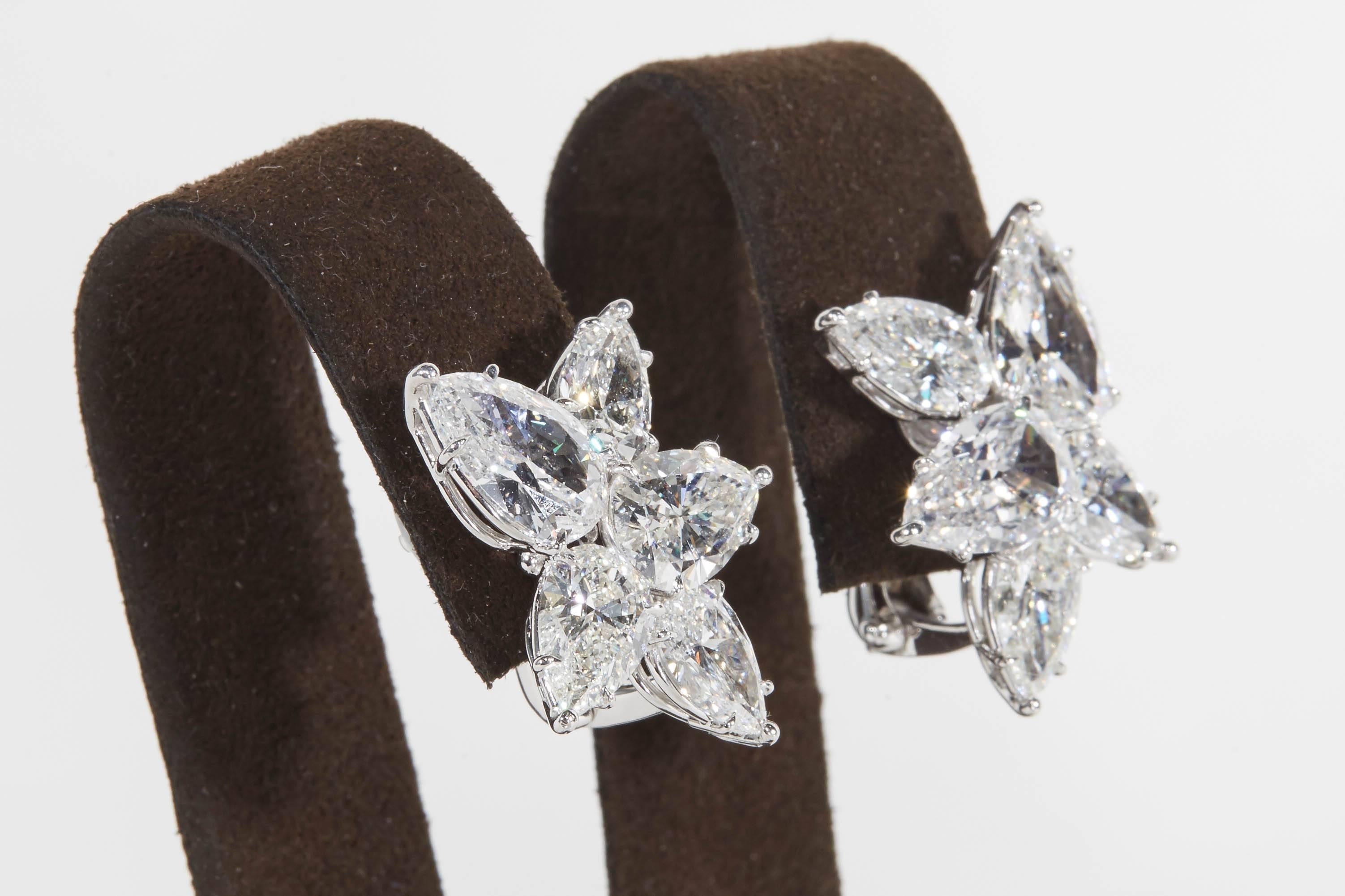 
An important pair of diamond cluster earrings.

11.82 carats of colorless white pear shaped diamonds 

Handmade in New York, set in platinum.

A fabulous pair of earrings -- they are magnificent in person.  

Just under an inch from the highest to