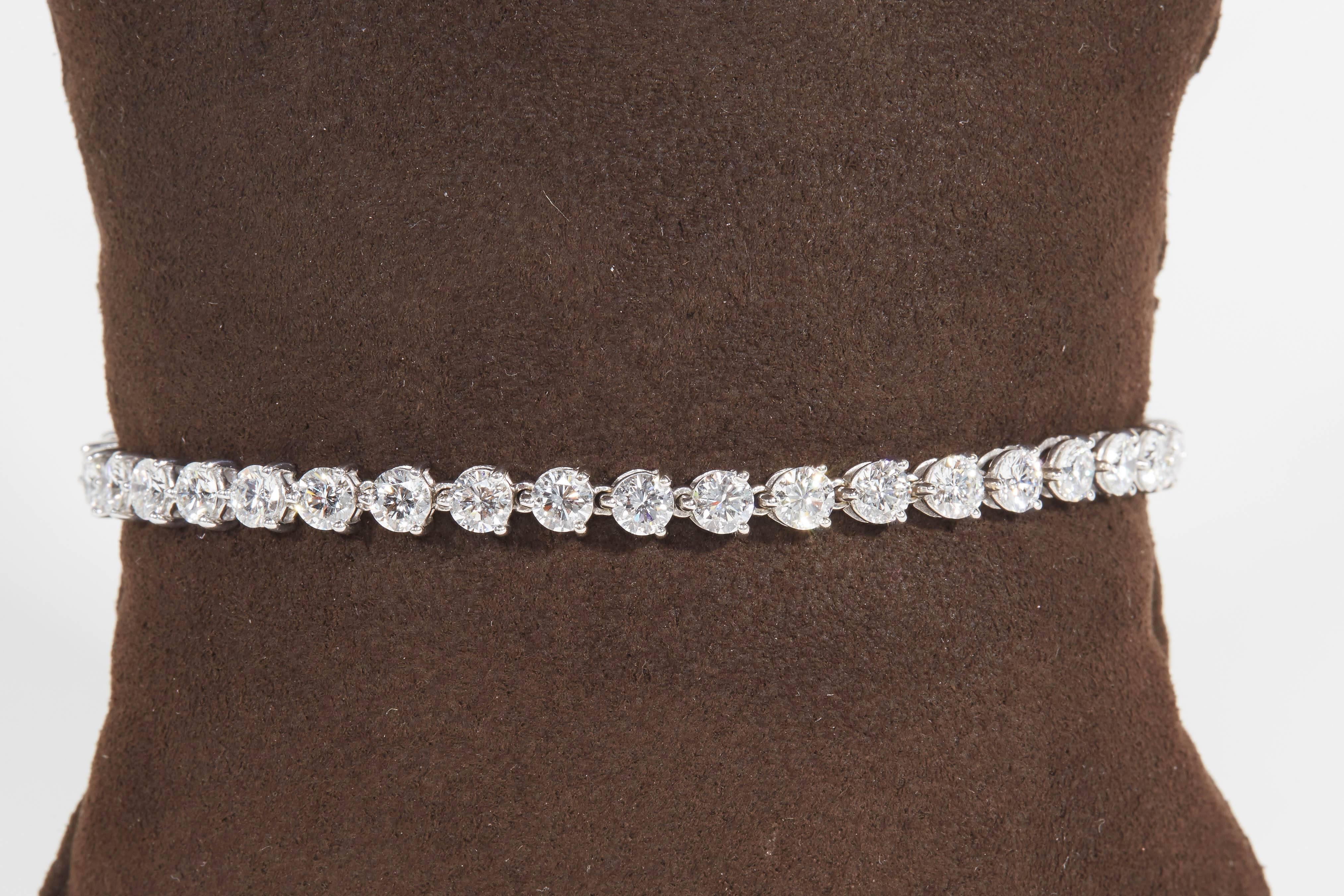 
A beautiful diamond tennis bracelet made with high quality round brilliant cut diamonds. 

This three prong bracelet was made to maximize diamond brilliance, a minimal amount of metal is used in this design. All you see are round diamonds!

8.21