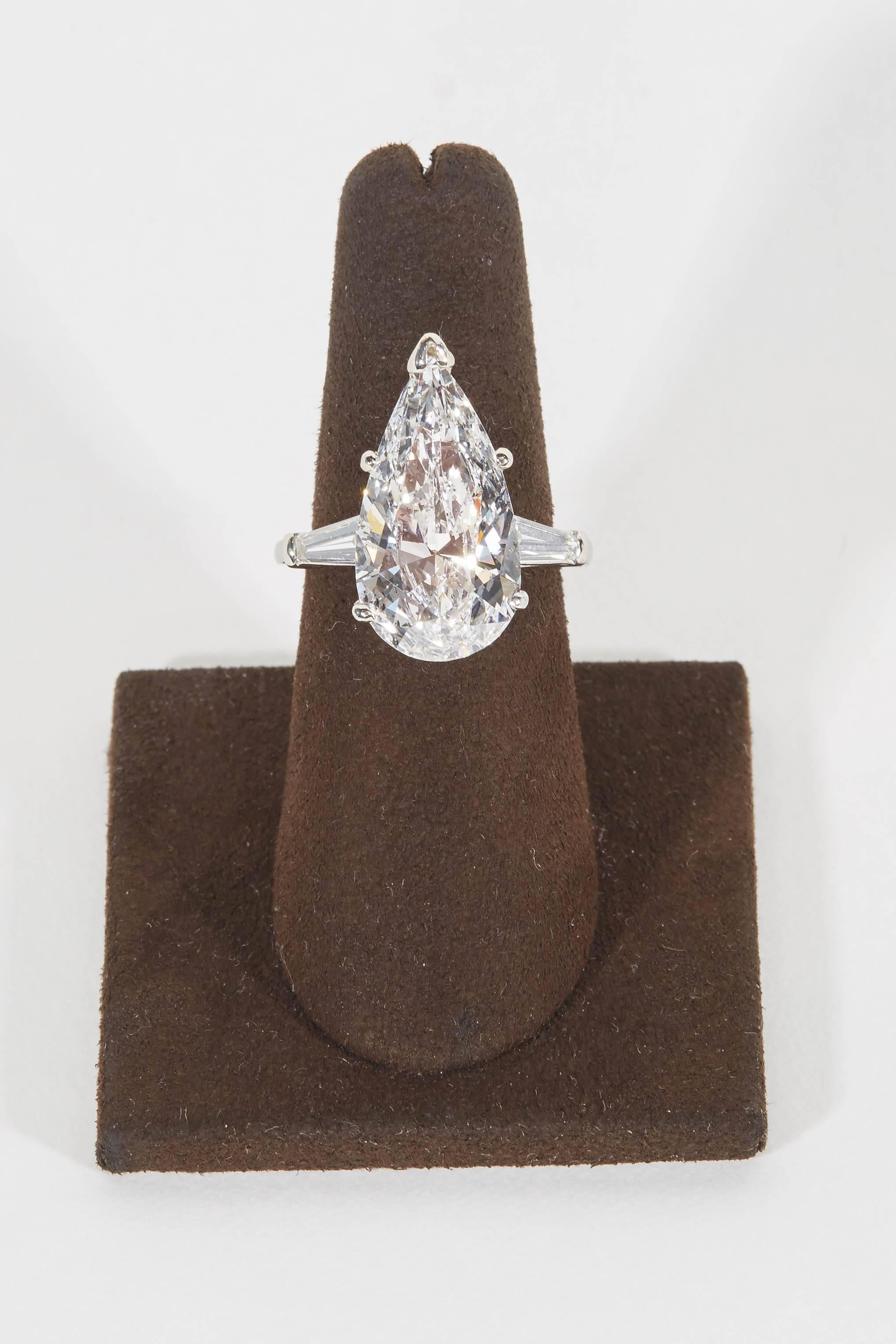 
A beautiful white diamond, full of brilliance and fire. 

Eight carat GIA certified D color I1 pear shape set with .60 cts of baguette diamonds on a platinum setting. 

The pear shape has the most beautiful shape and the diamond is eye clean with