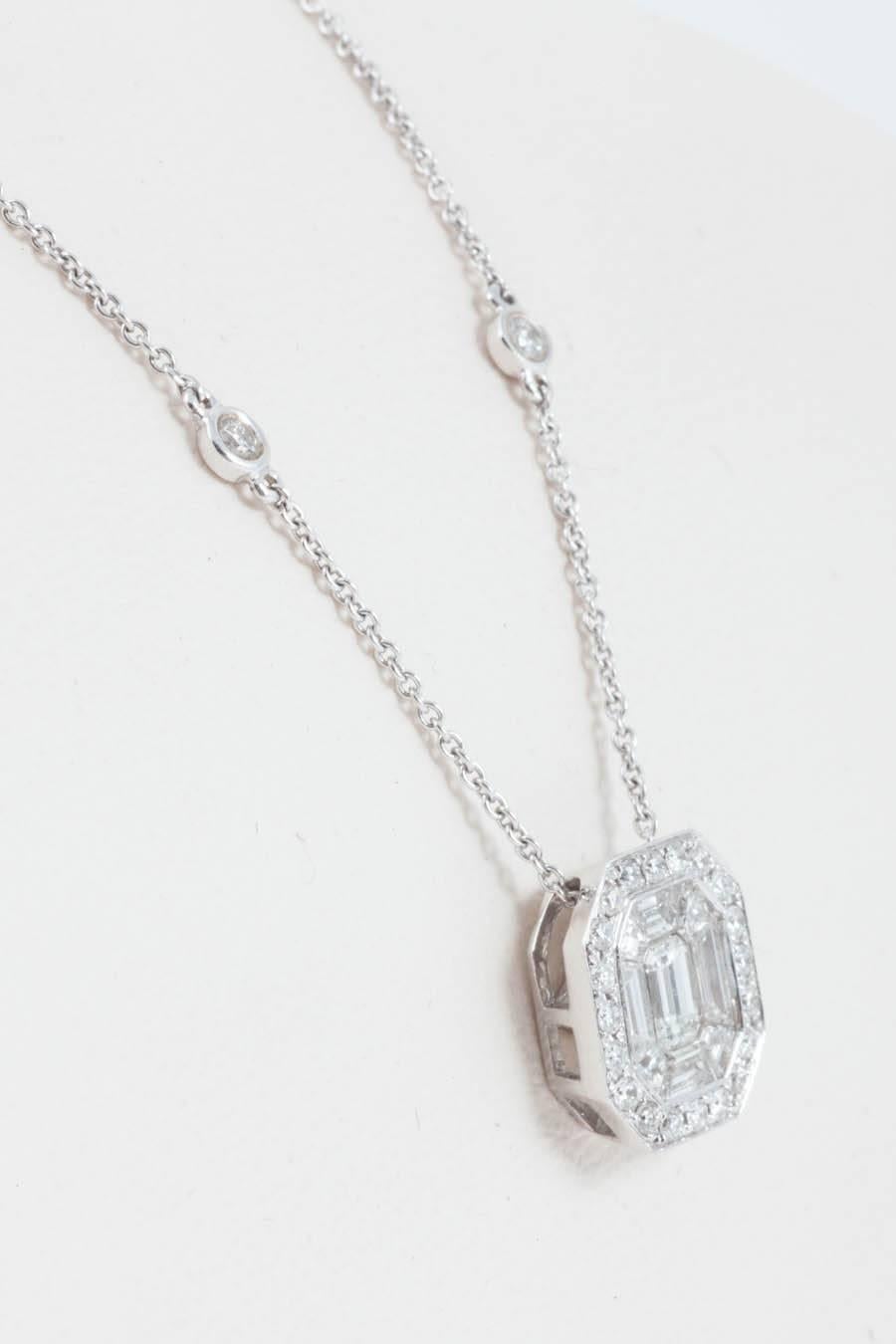 A very beautiful and wearable diamond pendant in a classic Art Deco manner set with baguette cut diamonds surrounded by round brilliant cut diamonds. With this mounting it looks just like a single centre stone. The diamonds are of G Rare White