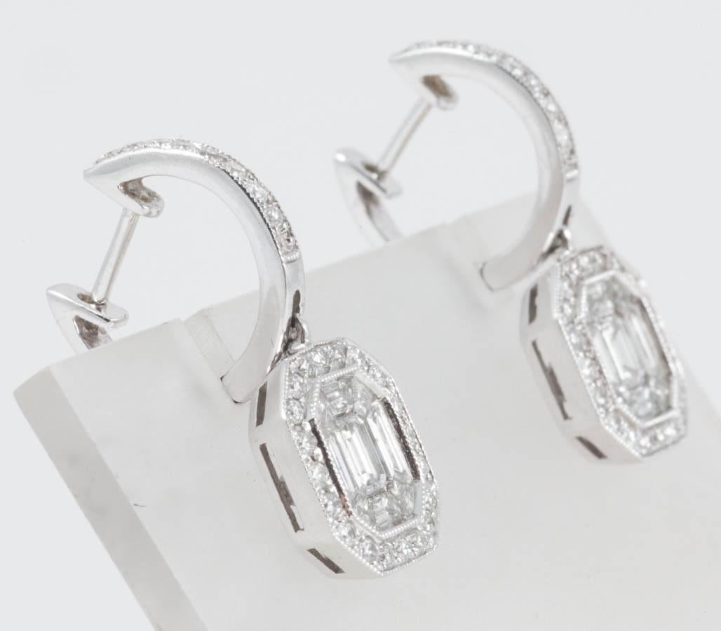 Extremely chic and eminently wearable diamond drop earrings. The diamond set hoop suspends beautifully formed cut cornered rectangles composed of round and baguette cut diamonds of G colour and SI1 clarity. Total weight of approximately 1.71 carats