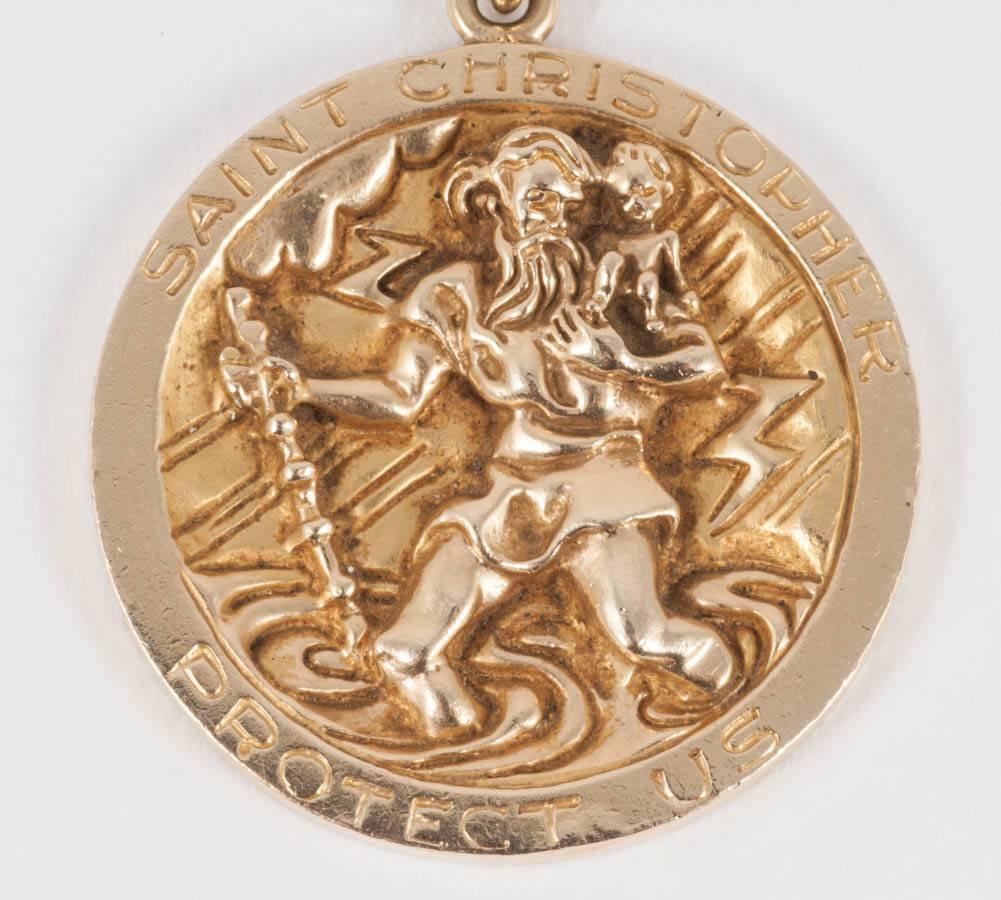 Late 20th century 14 carat gold medallion showing St Christopher in bas relief. Total weight 51.34 grams.