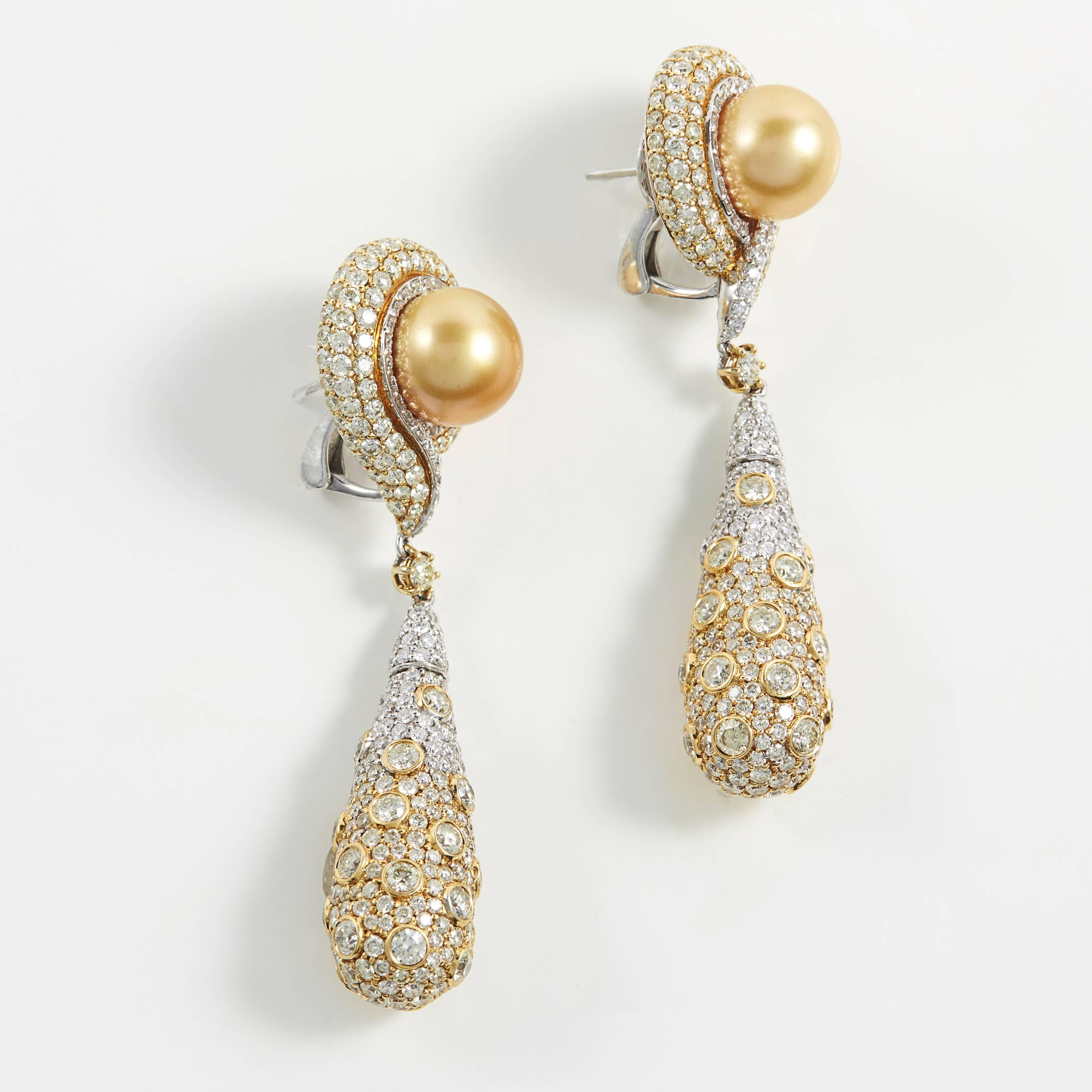 SAM.SAAB 18k yellow gold with  10mm golden south sea pearl and 5.73ct yellow diamonds as well as 4.95ct white diamonds. This earrings length is approximately 3 inches.