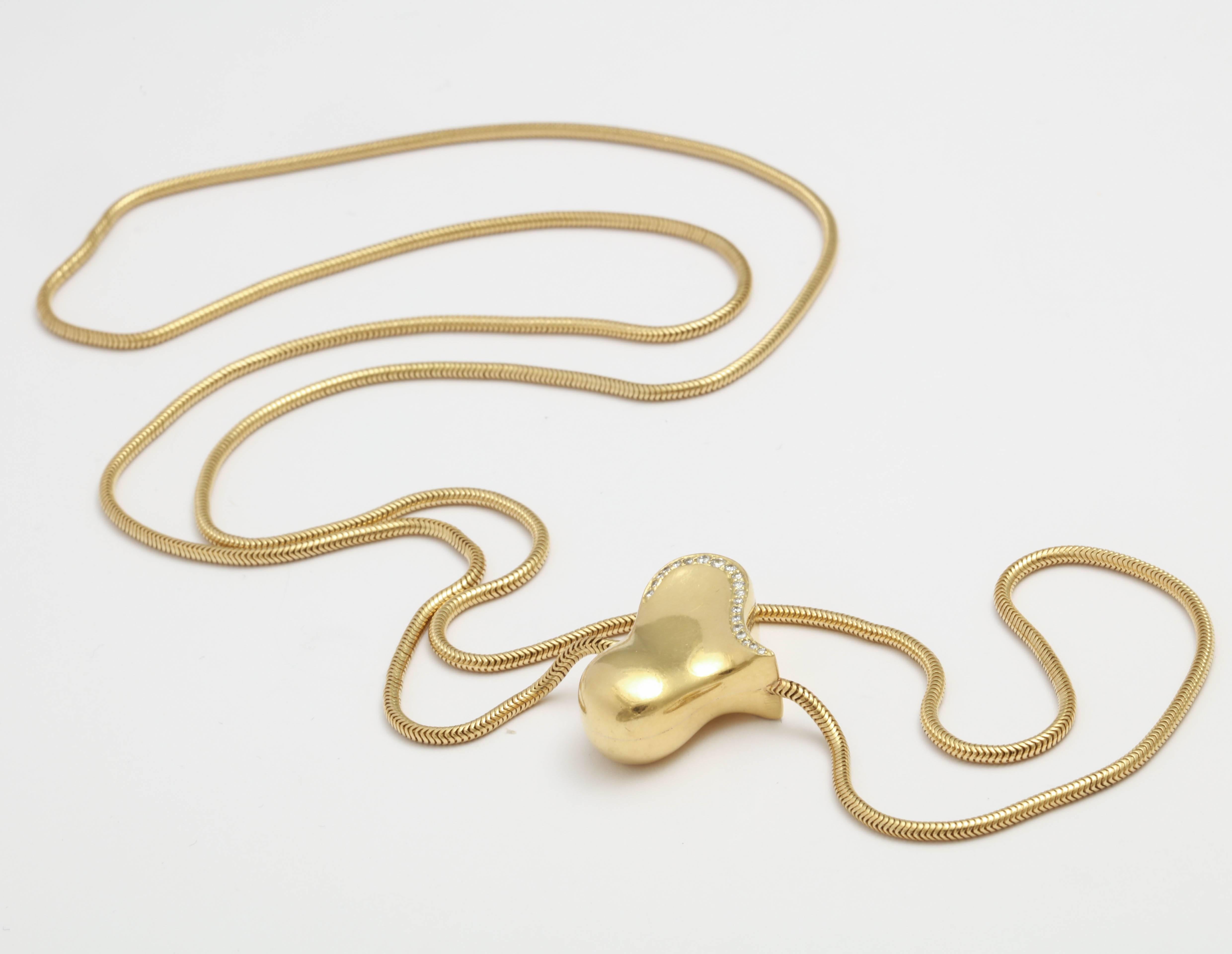 Early Angela Cummings 18kt Gold Snake chain with a Gold & Diamond studded Heart attached in-between the chain
Double sided Heart with a border of 20 Diamonds pave set on each side.  Signed@1984Cummings18. on both sides. Can be worn singly or doubled