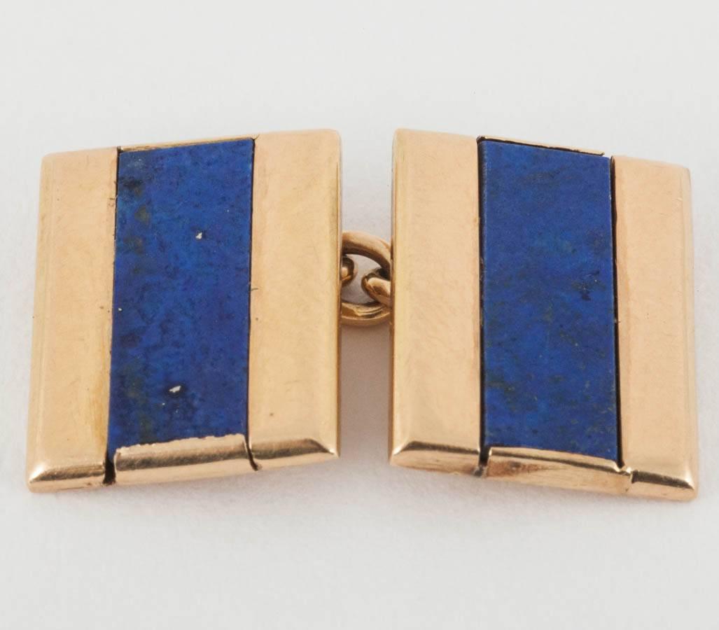 A heavy quality pair of oblong shaped double sided cufflinks in 18 karat yellow gold with a central strip of natural lapis lazuli. Chain link connections with a French mark of the eagles head.
Measures 10mm in width x 13mm in height.
Vintage piece