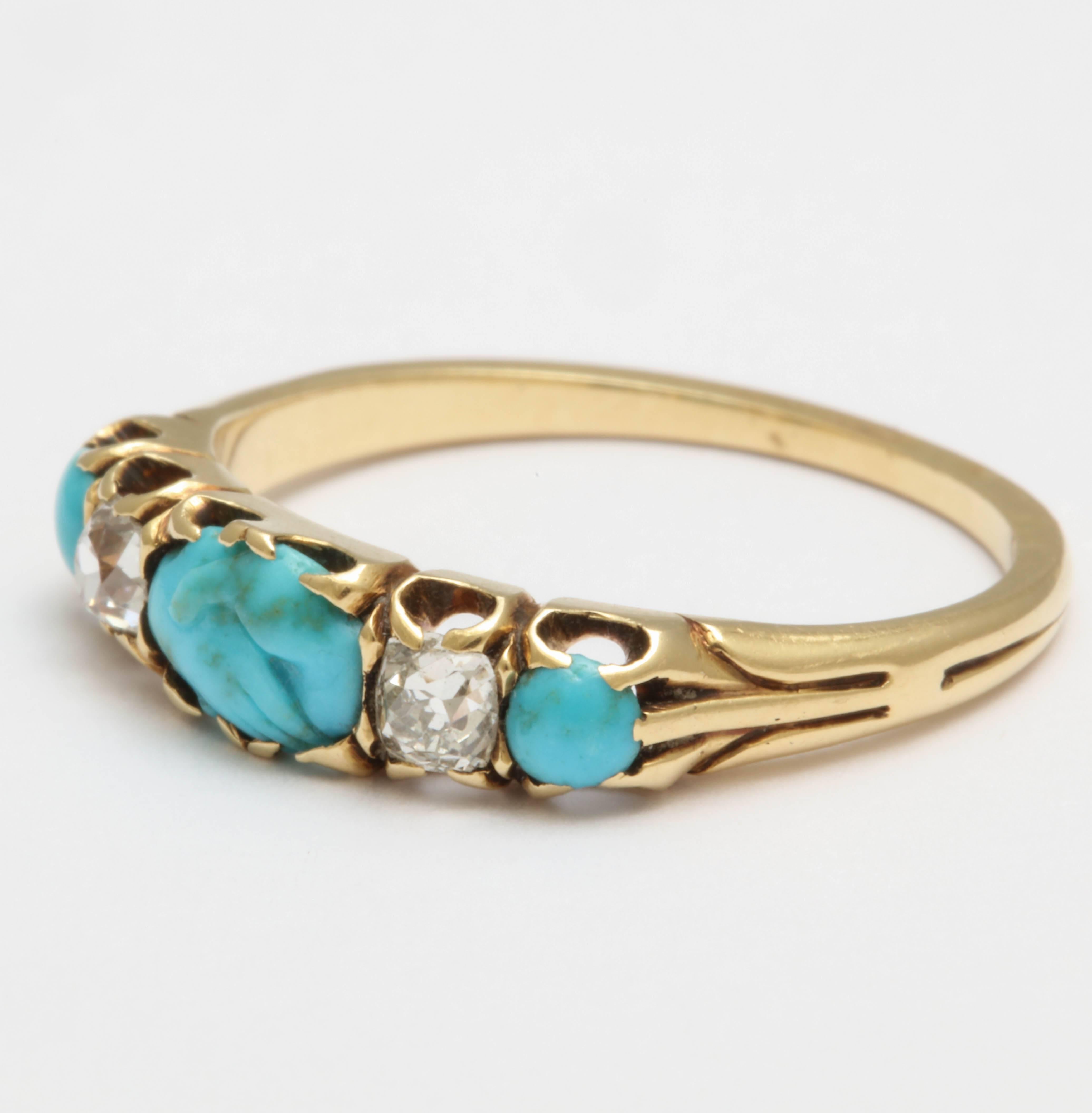 Fede, to hands clasp in union, was a popular motif of the Georgian and Victorian Era. The central carved turquoise of the two hands is possibly Georgian or Victorian, yet the ring and the mounting is certainly of Victorian design. Flanking the