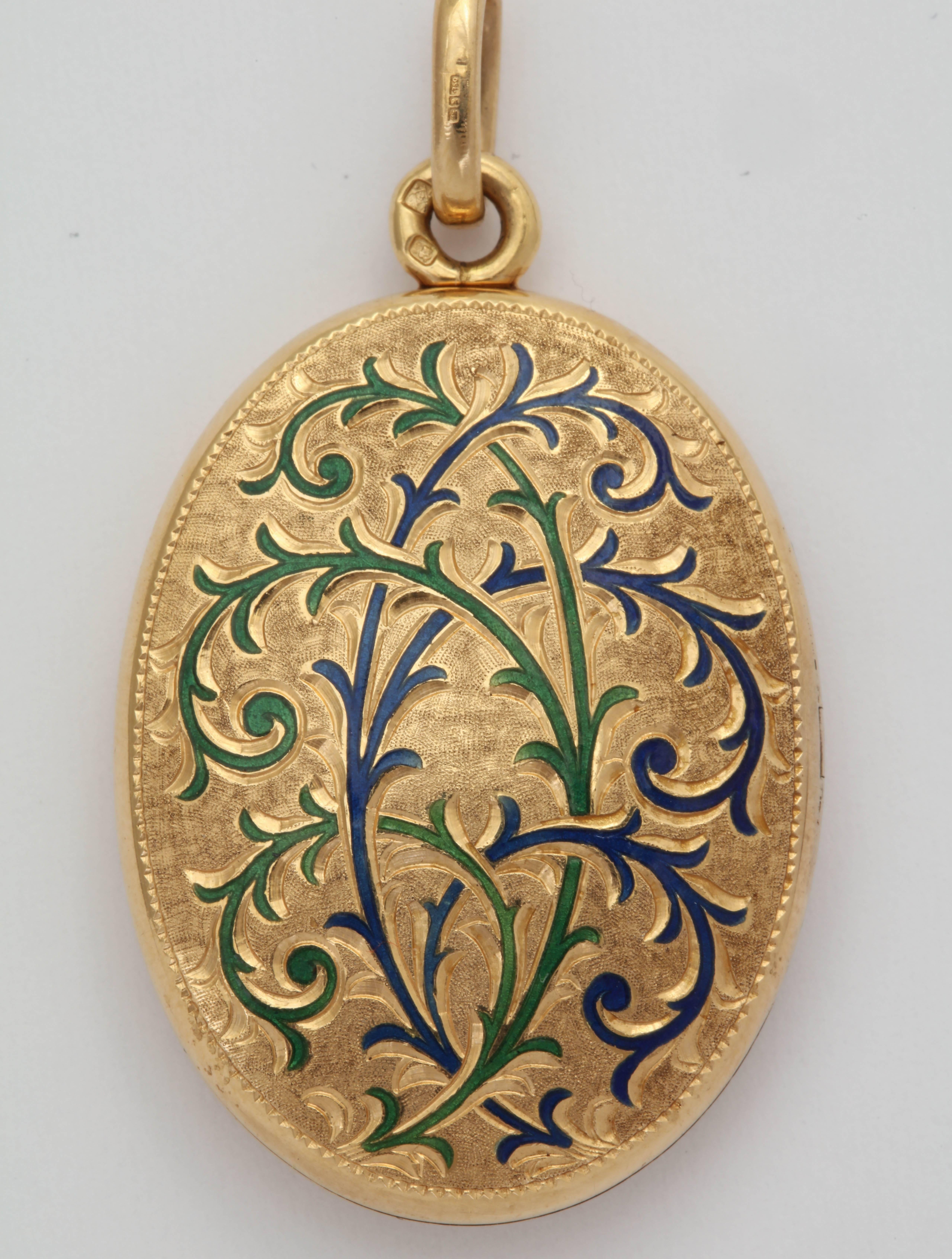 Made in the 70s in England, yet reflecting the turn of the century Art Nouveau style, this locket is beautifully made in 18kt. Engraving throughout the front and minimally on the back. The front has blue and green enamel.