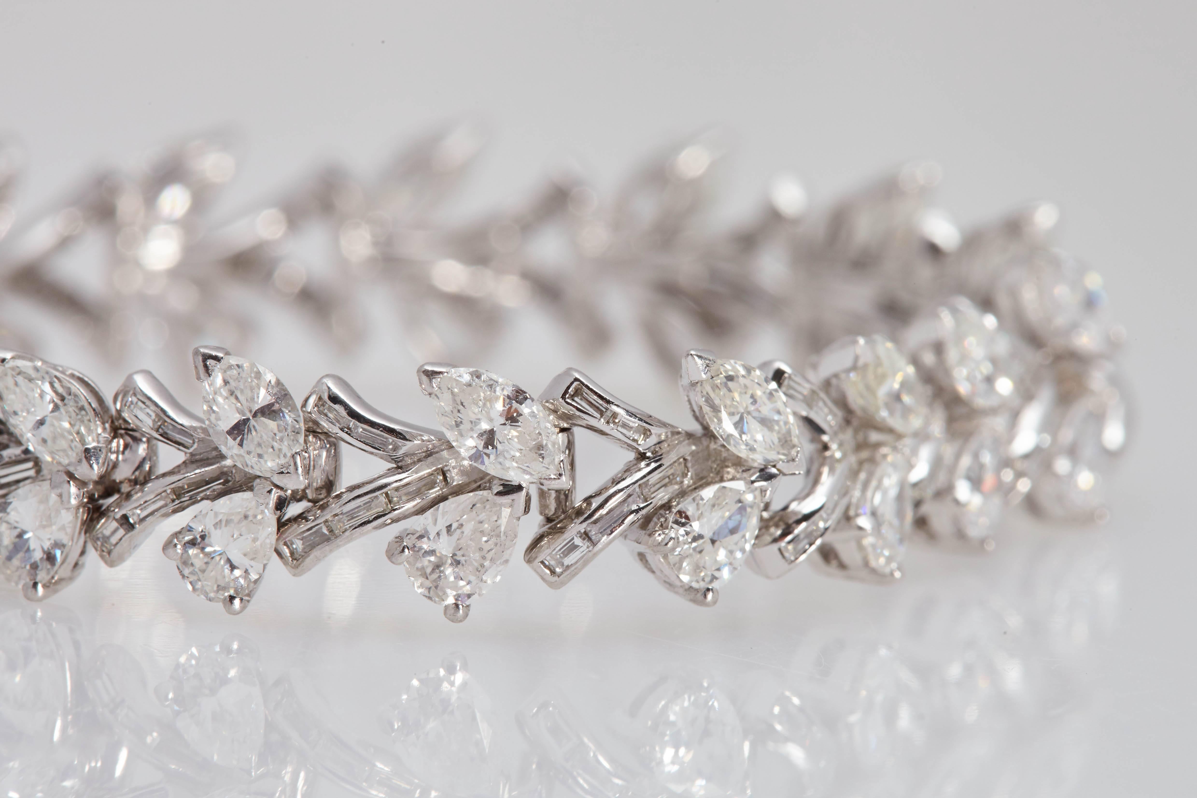 Diamond and platinum bracelet consisting of eighteen pear shaped diamonds and eighteen marquise shaped diamonds with a total weight of approximately 11.50 carats. The diamonds are "H/I" in color and "VS/SI" in clarity. Each set