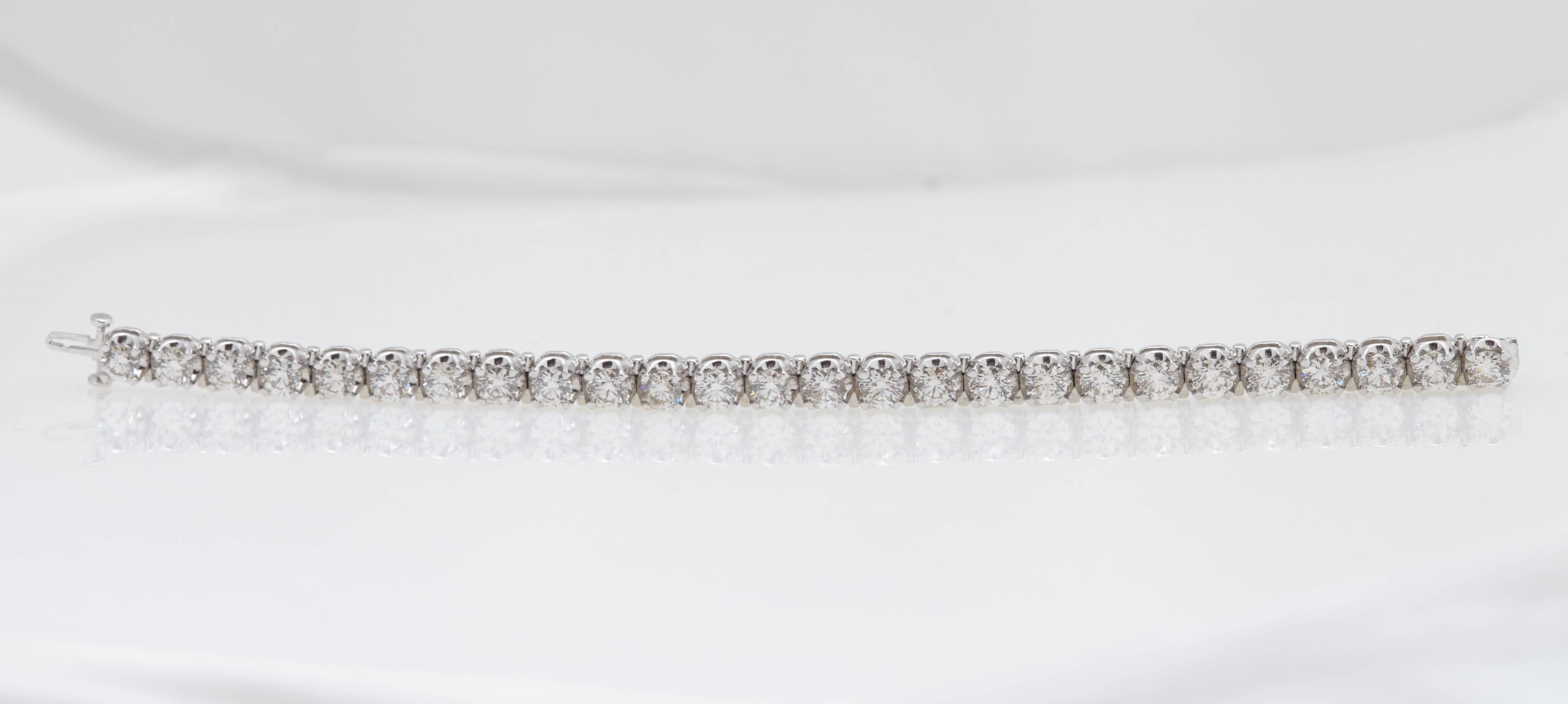 Beautiful fourteen karat white gold tennis bracelet made up of 26 round diamonds with a total weight of 13.26 carats. The average weight of the diamonds is over .50 carat. The diamonds are "H/I" in color and "SI" in clarity.  The