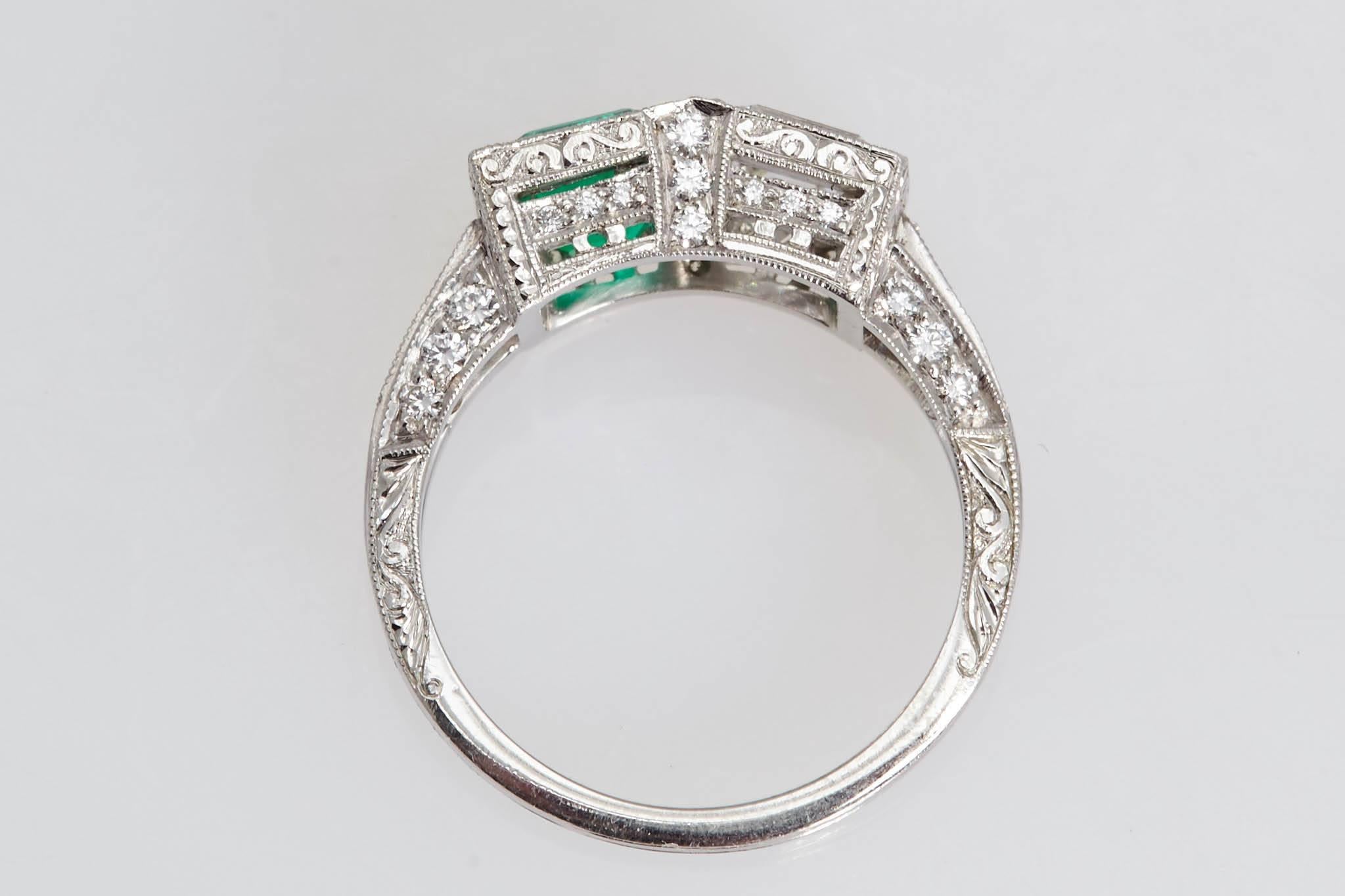 Beautiful two stone platinum ring with a square diamond weighing 1.01 carats and a square Columbian emerald weighing .99 carat.  The diamond has a certificate from the Gemological Institute of America stating that it is "G" in color and