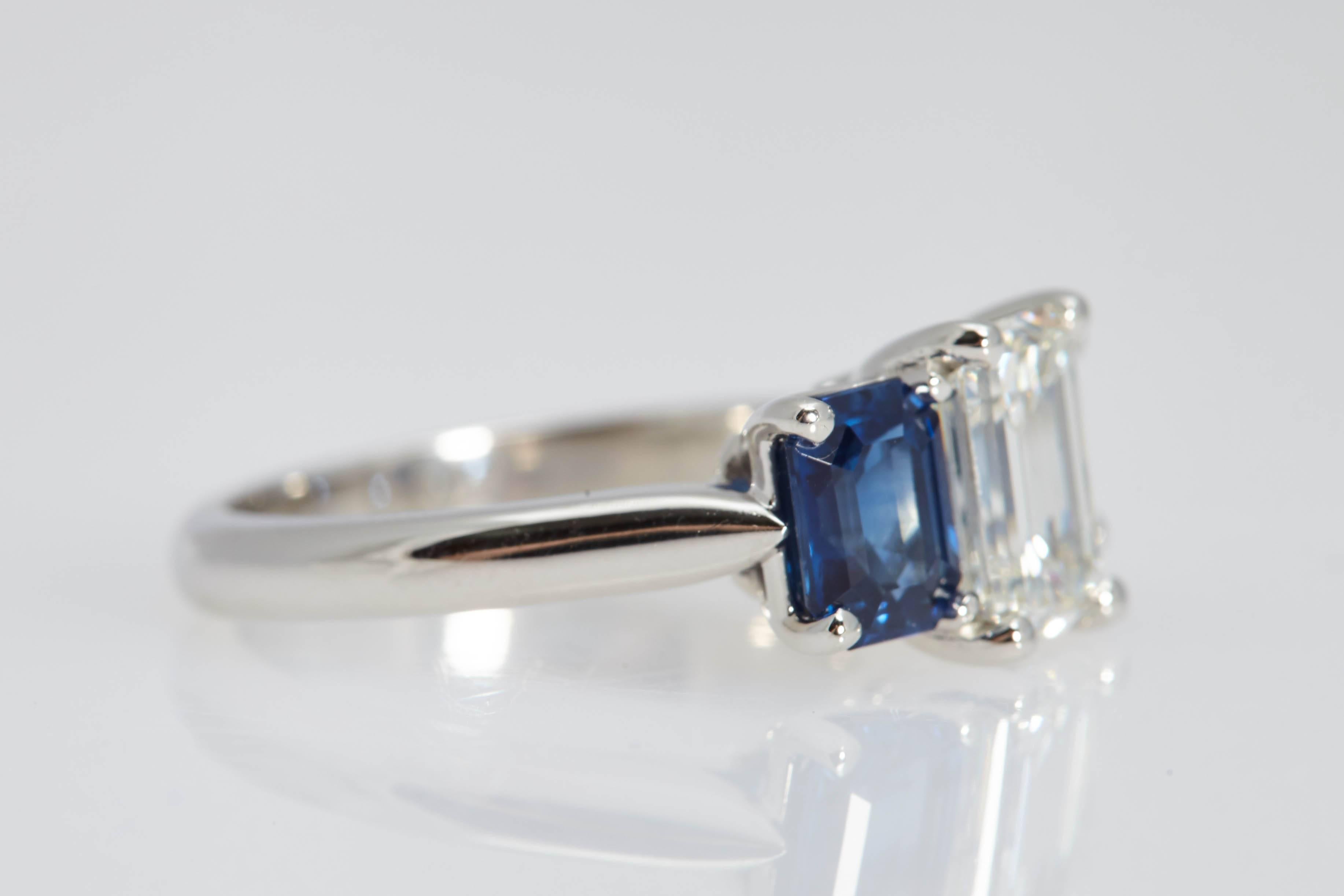 Modern 1.55 Carat GIA Emerald Cut Diamond Side Sapphires Platinum Three-Stone Ring For Sale