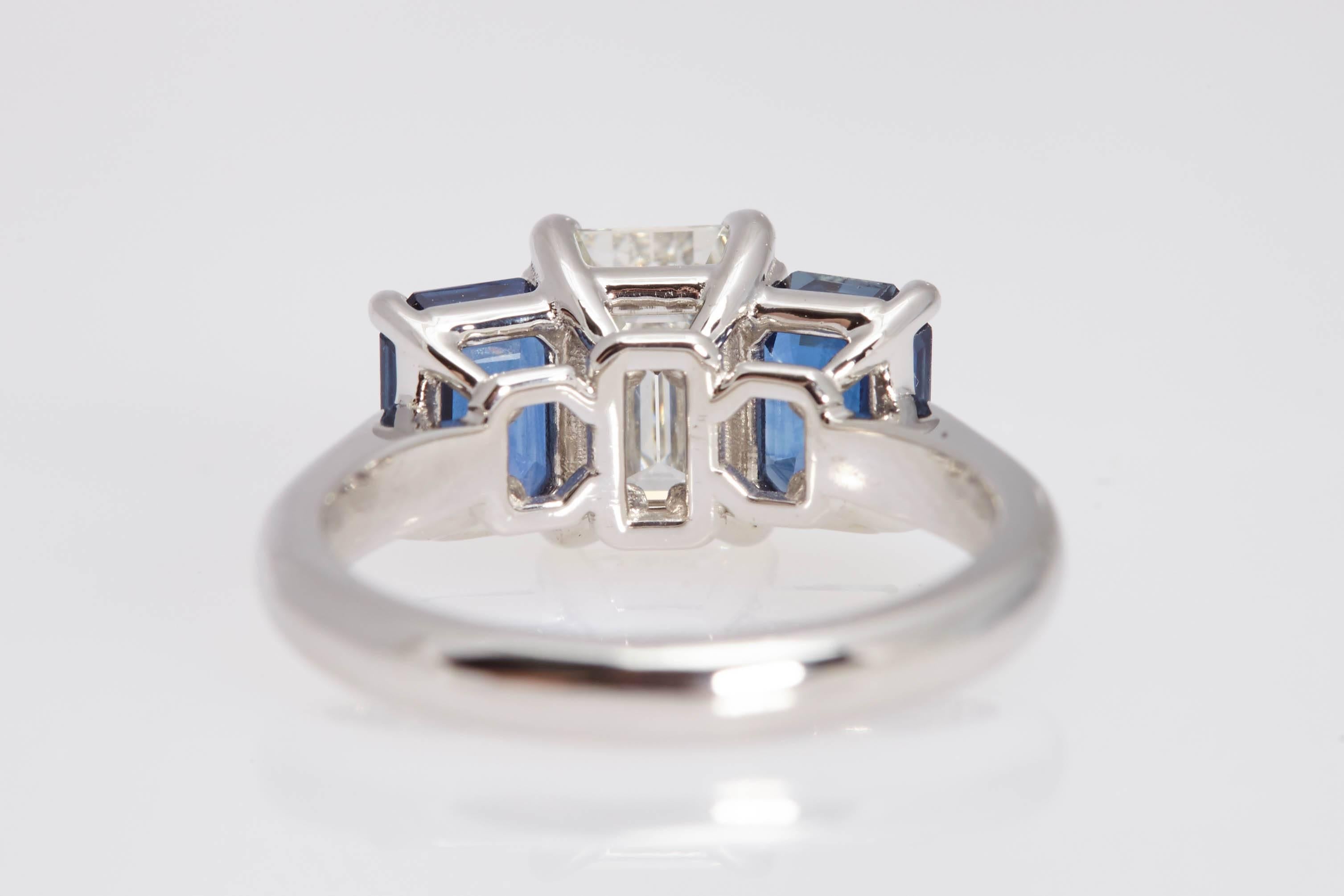 1.55 Carat GIA Emerald Cut Diamond Side Sapphires Platinum Three-Stone Ring In Excellent Condition For Sale In New York, NY