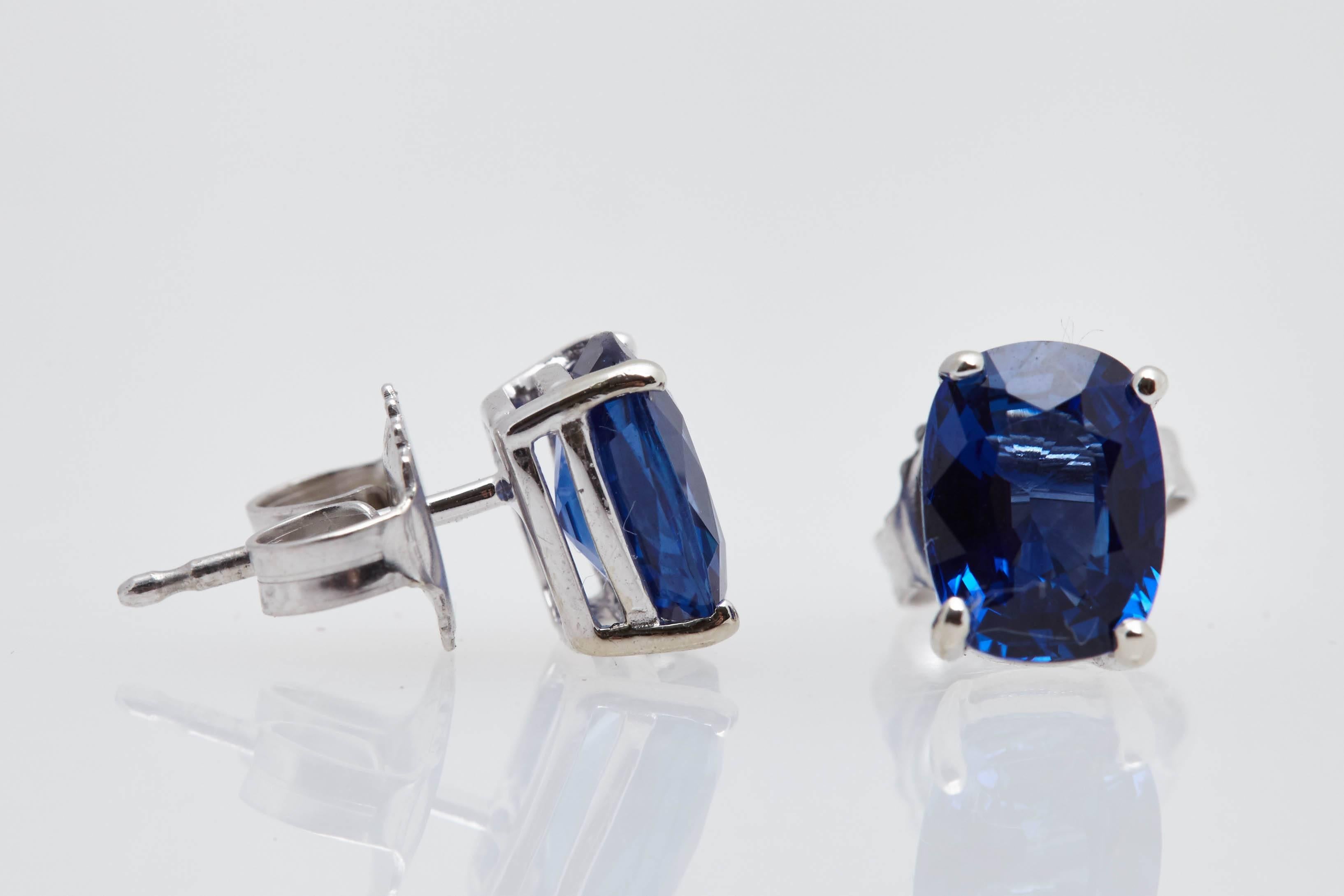 Pair of beautiful cushion shaped blue sapphires with a total weight of 2.81 carats.  The sapphire's are mounted in fourteen karat white gold push back earrings.  The sapphires measure approximately 7.5 mm.x 5.6 mm.