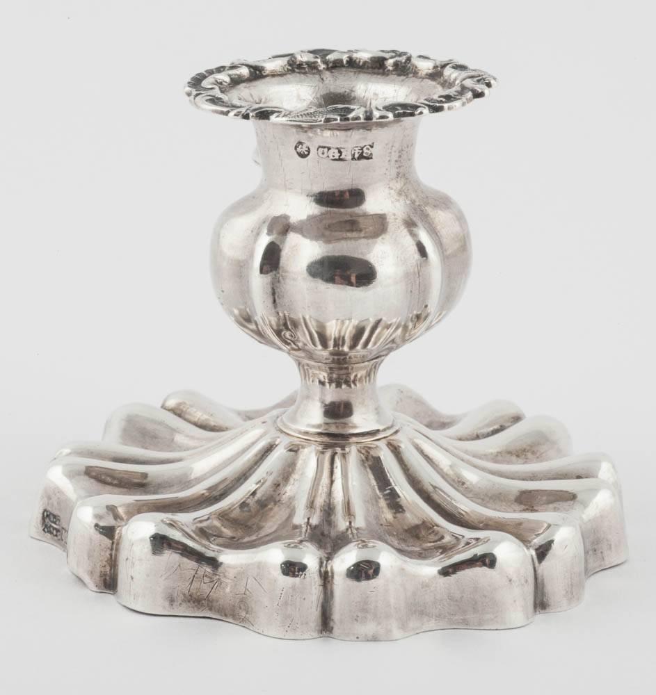 From the Romanov era, period of Tsar Nicholas I, of bulbous form on a ribbed pedestal base, with shell shaped thumbpiece and scrolling rim. 

St. Petersburg, 1844, maker’s mark CGE, hallmarked in two places. 

2 ¼ in. (5.7 cm.) high; the base: 3 1/4