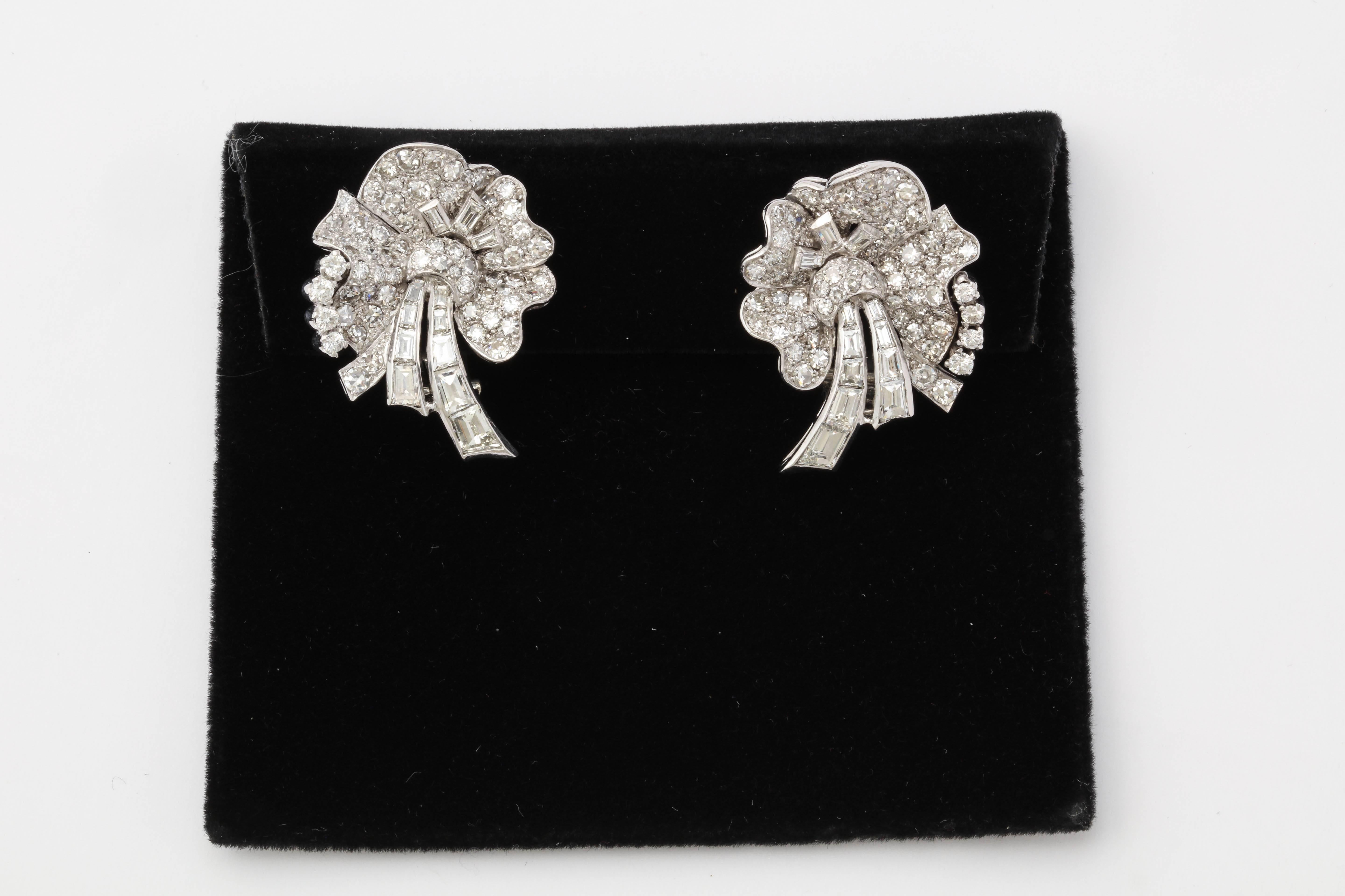 One Pair Of Ladies Platinum Earrings Embellished With Numerous round Cut Diamonds weighing Approximately 3.75 Cts. Pansy Flower earrings further Designed with 24 Baguettes weighing Approximately 1.25 Cts. Total weight Of diamonds approximately 