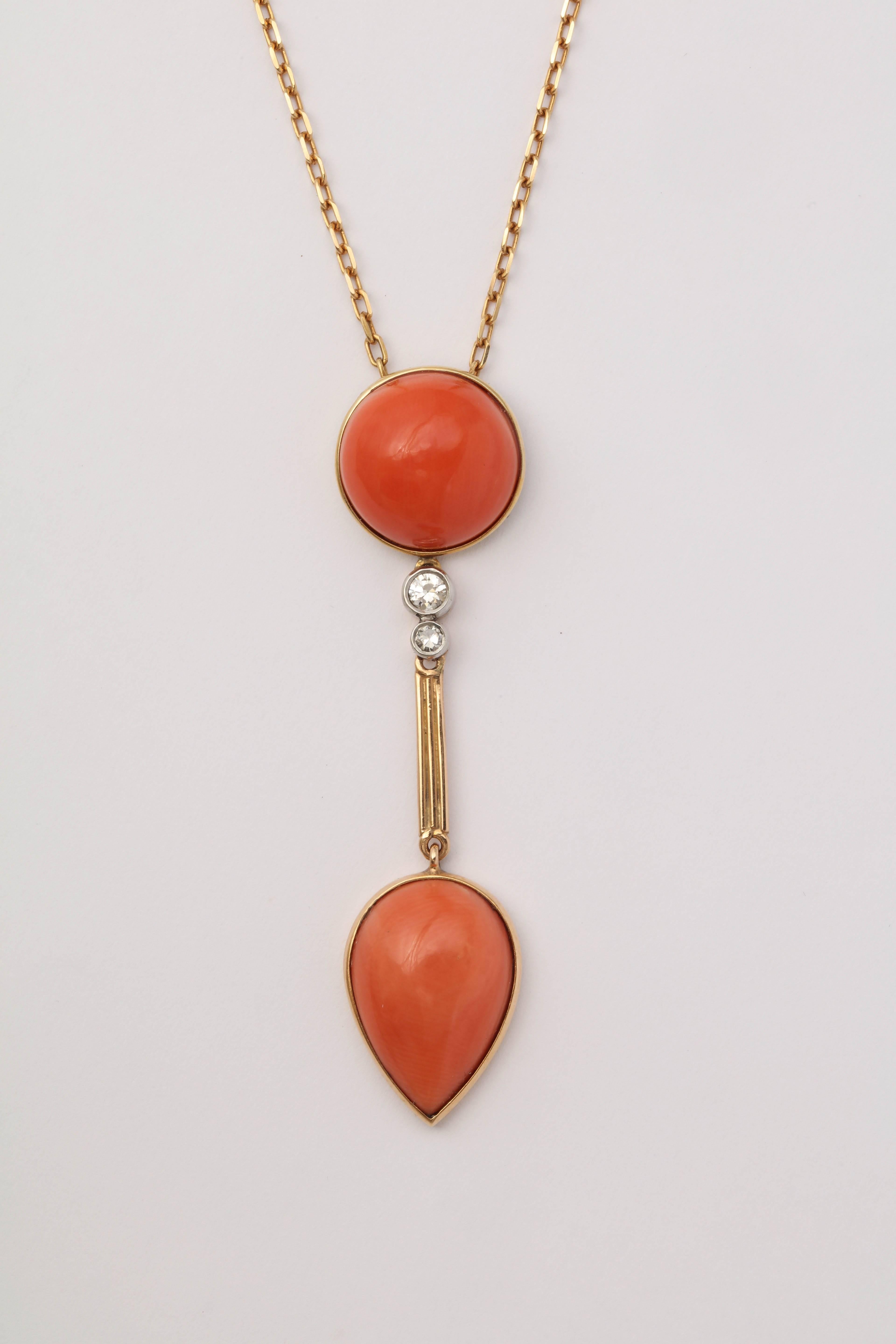 One Ladies 18kt Yellow Gold Open Box Link Chain Pendant Drop Necklace Embellished With One Bezel Set Round Cabochon Angel Skin Coral Measuring Approximately 13Mm And Further Designed With A Cabochon Bezel Set Pear Shaped Angel Skin Coral Stone