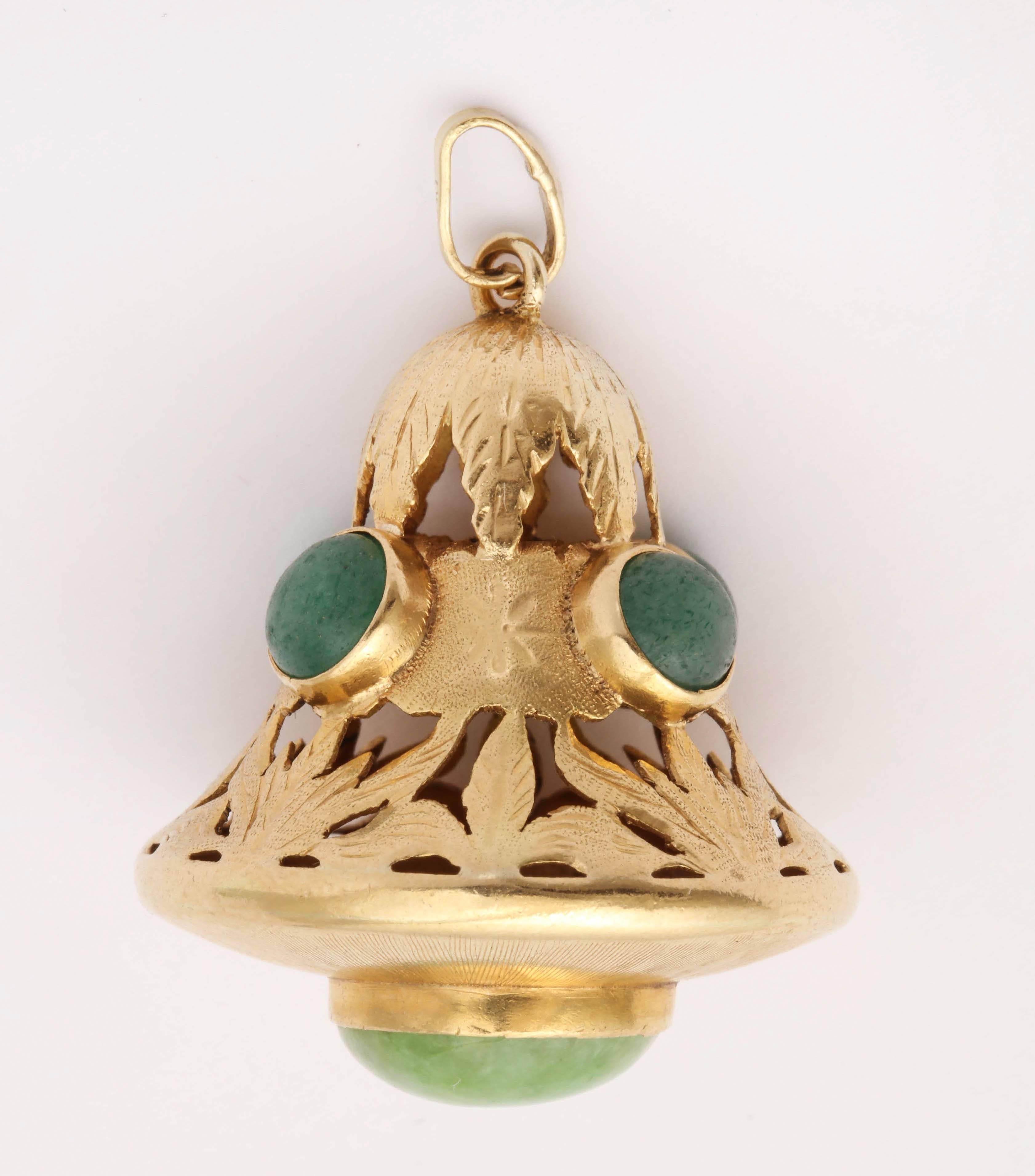 One 18kt Yellow Gold Charm Designed With Five Cabochon Green Quartz Stones.Charm Is Beautifully Made With Open Floral Design Craftmanship.Further Embellished With One Large Bezel Set Cabochon Green Quartz Stine Surrounded By A Beautiful Sunburst