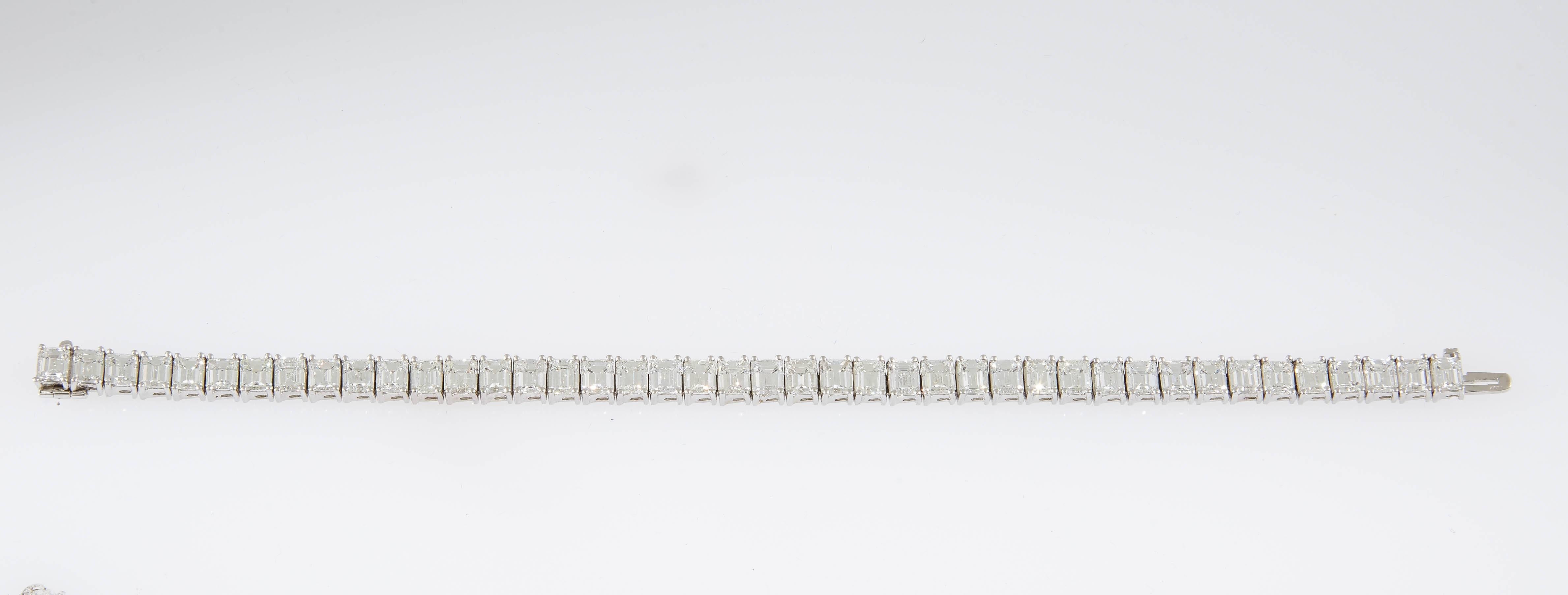 Gorgeous emerald cut diamonds, weighing in total approximately 21.27 carats, make up this elegant platinum line bracelet. This classic stunner measures 7 inches in length, HI color, VS1/SI1 clarity.  
This exceptional take on an enduring design is a