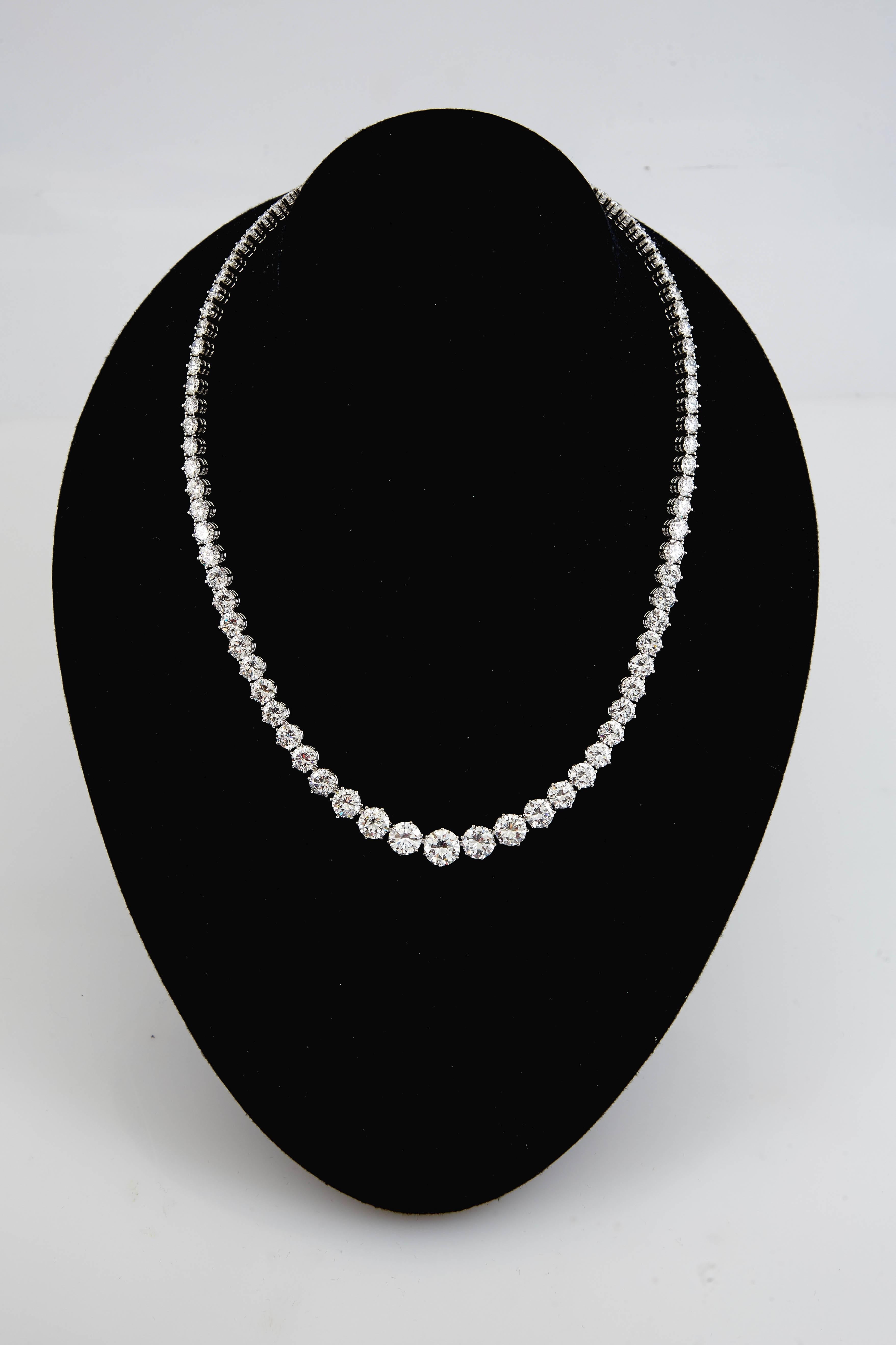 A traditional and an elegant necklace is finely crafted in platinum with 41.00 carat of graduating  diamond diamonds. 7 center stones are GIA certified. The center stone is 2.06 ct. F VS1 GIA #2141928028, 1.57 ct.  DVS1 GIA #114692391, 1.50 ct.