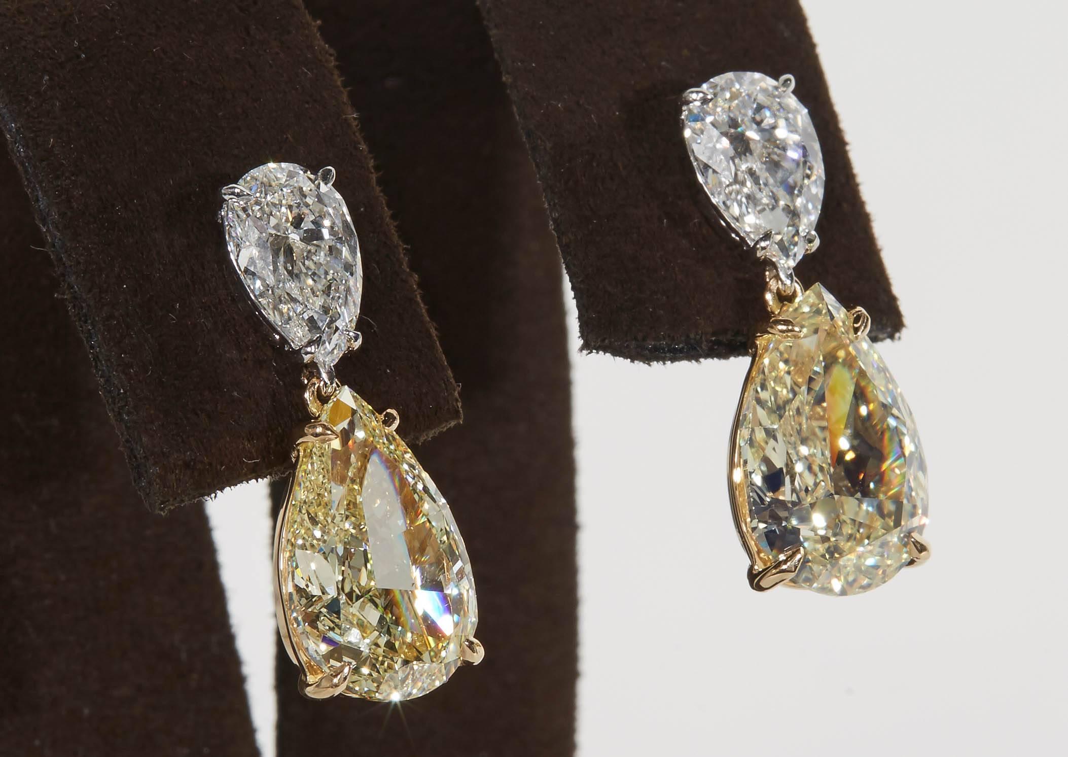 
An impressive pair of diamond earrings! Each of the four diamonds are certified by GIA!

6.80 carats of Fancy Light Yellow diamonds, VS2.

2.01 carats of white, F color diamonds, SI1.

18k white and yellow gold

Approximately .80 inches in length.