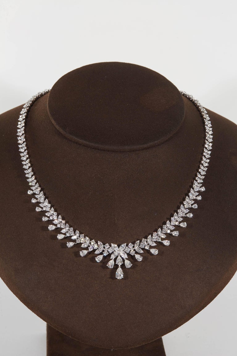 
An impeccably designed diamond necklace featuring pear, marquise, and round cut diamonds. 

18.20 carats of FG VS diamonds 

18k white gold

Approximately 16.5 inch length that can easily be adjusted. 