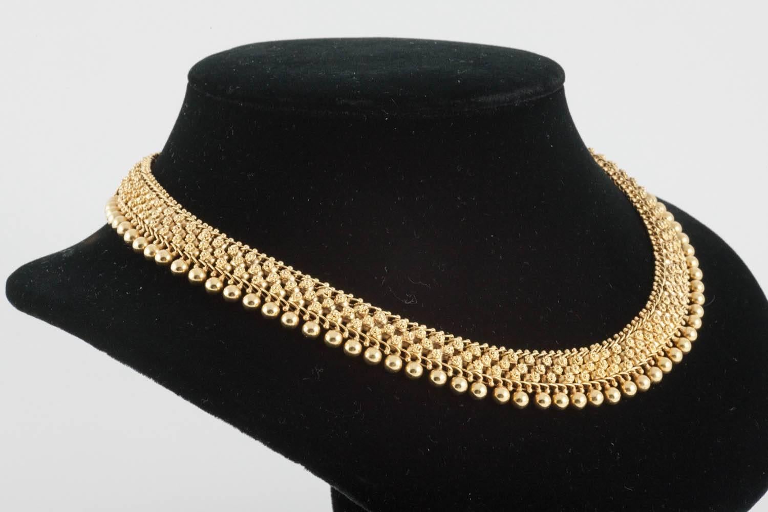 A fine quality, 19 th century 18 ct yellow gold collar necklace 16 inches with extension chain in length, the Goldwork and beading in perfect condition, and the original soft patina also, 20 mm wide, English c,1870