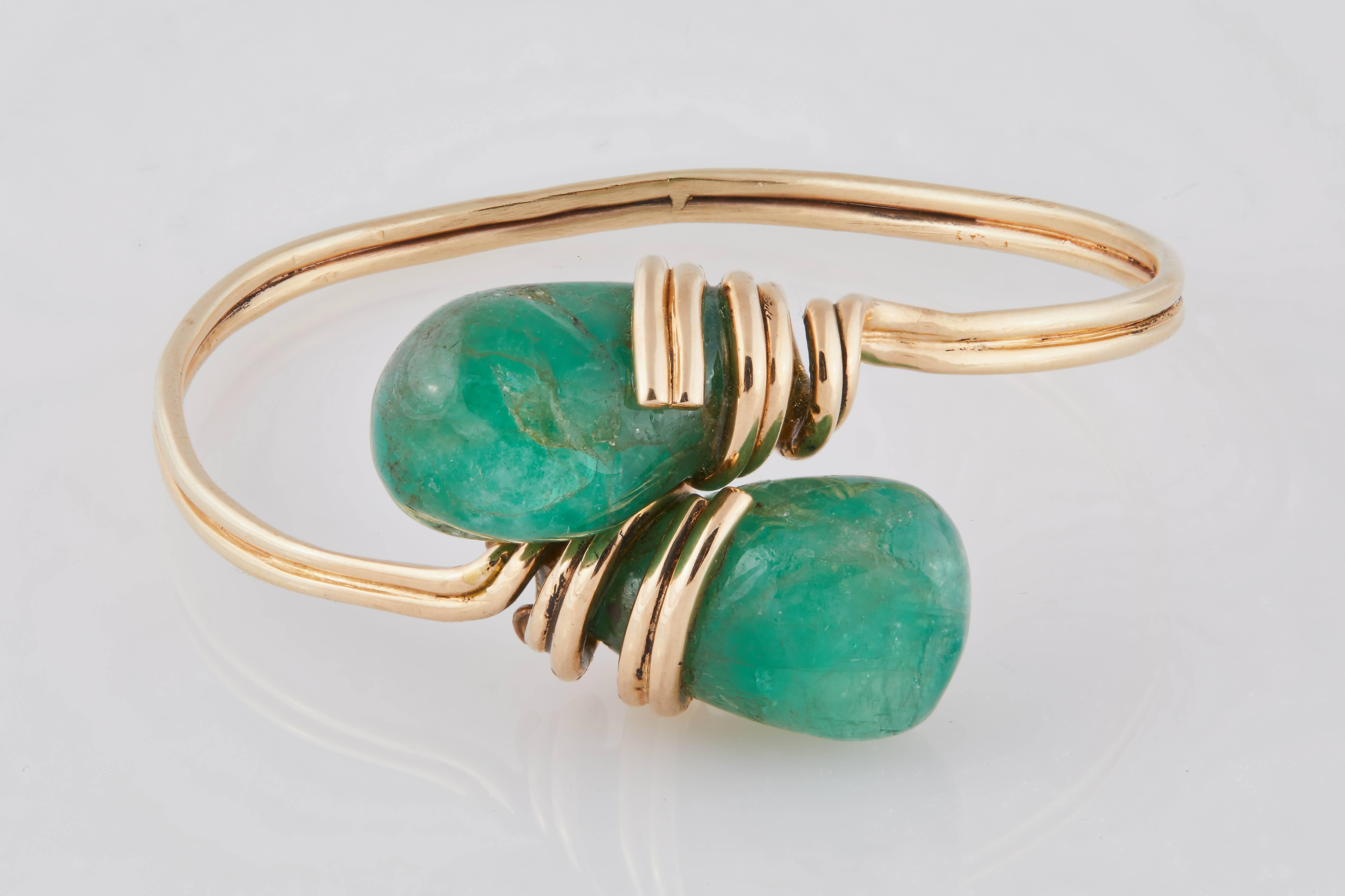 14k yellow gold bracelet with two emerald drops. Emeralds are roughly 24mm H x 15.5mm W