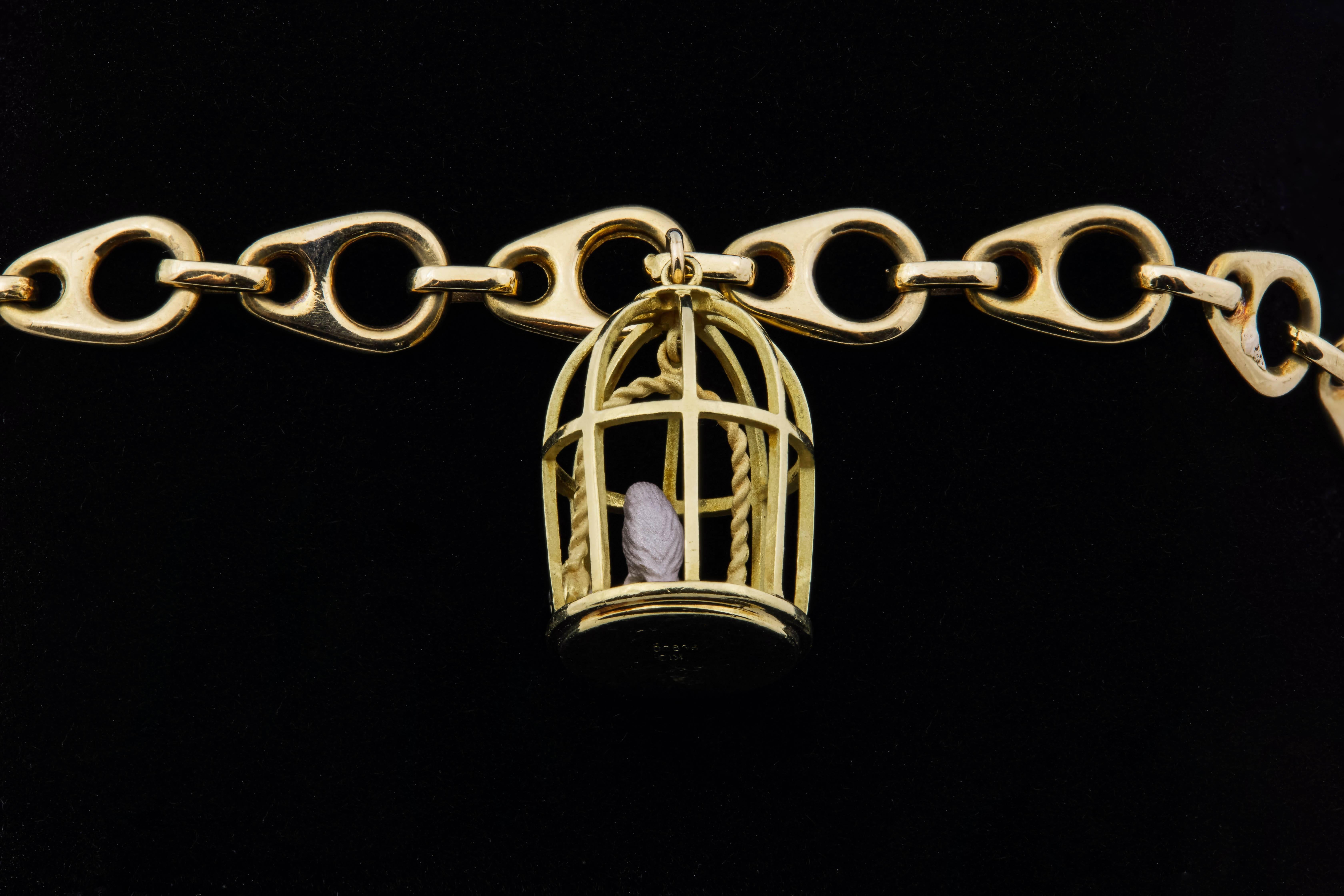 1960s French 18 Karat Gold Link Bracelet with Vintage Gold Birdcage Charm In Excellent Condition In Chicago, IL
