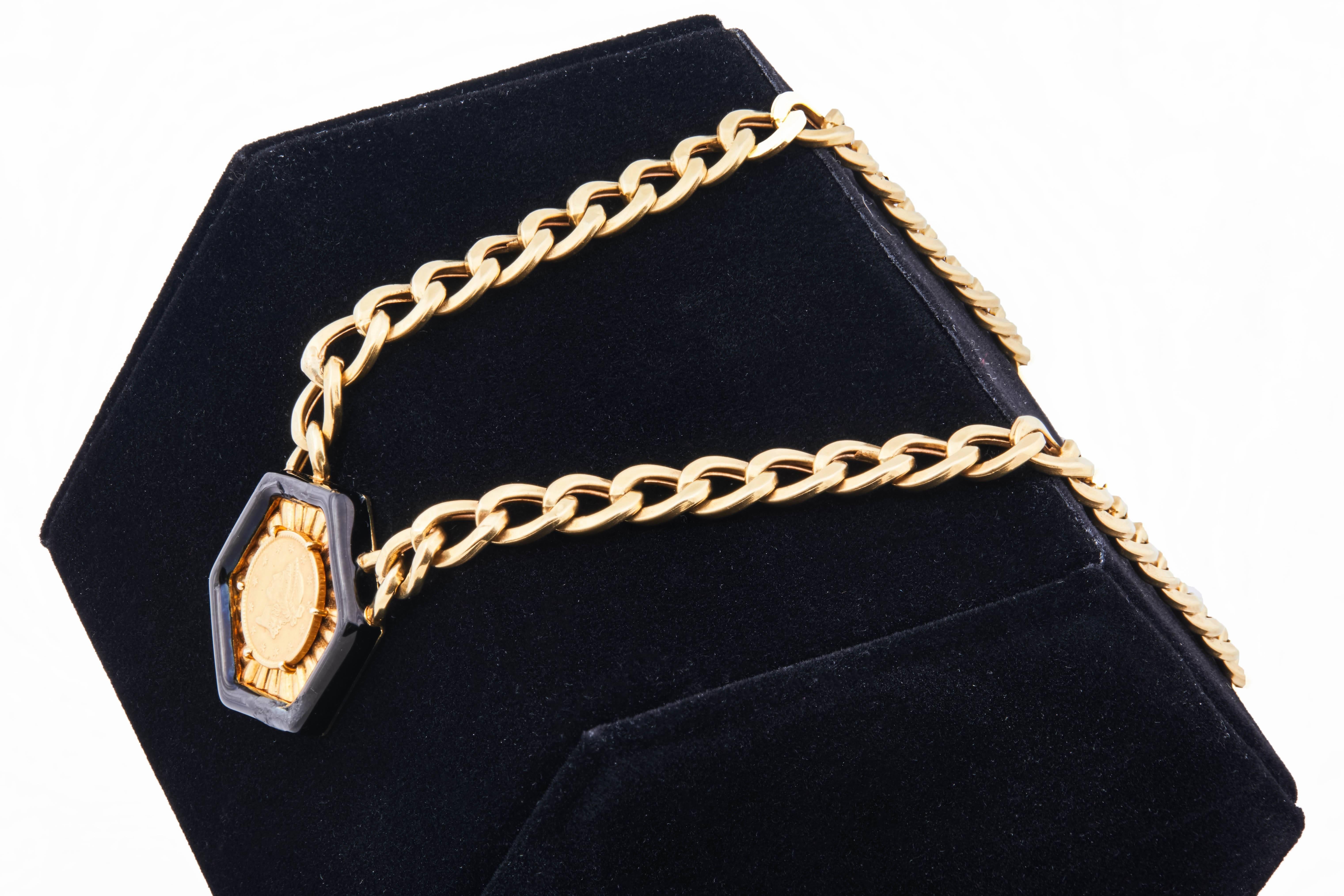 Vintage 1970s David Webb 1851 Liberty Head Dollar on a gold chain necklace. The coin is set in a black enamel hexagonal pendant. The pendant and chain are both 18K yellow gold while the coin gold content is 90% (roughly 22k). Chain length is