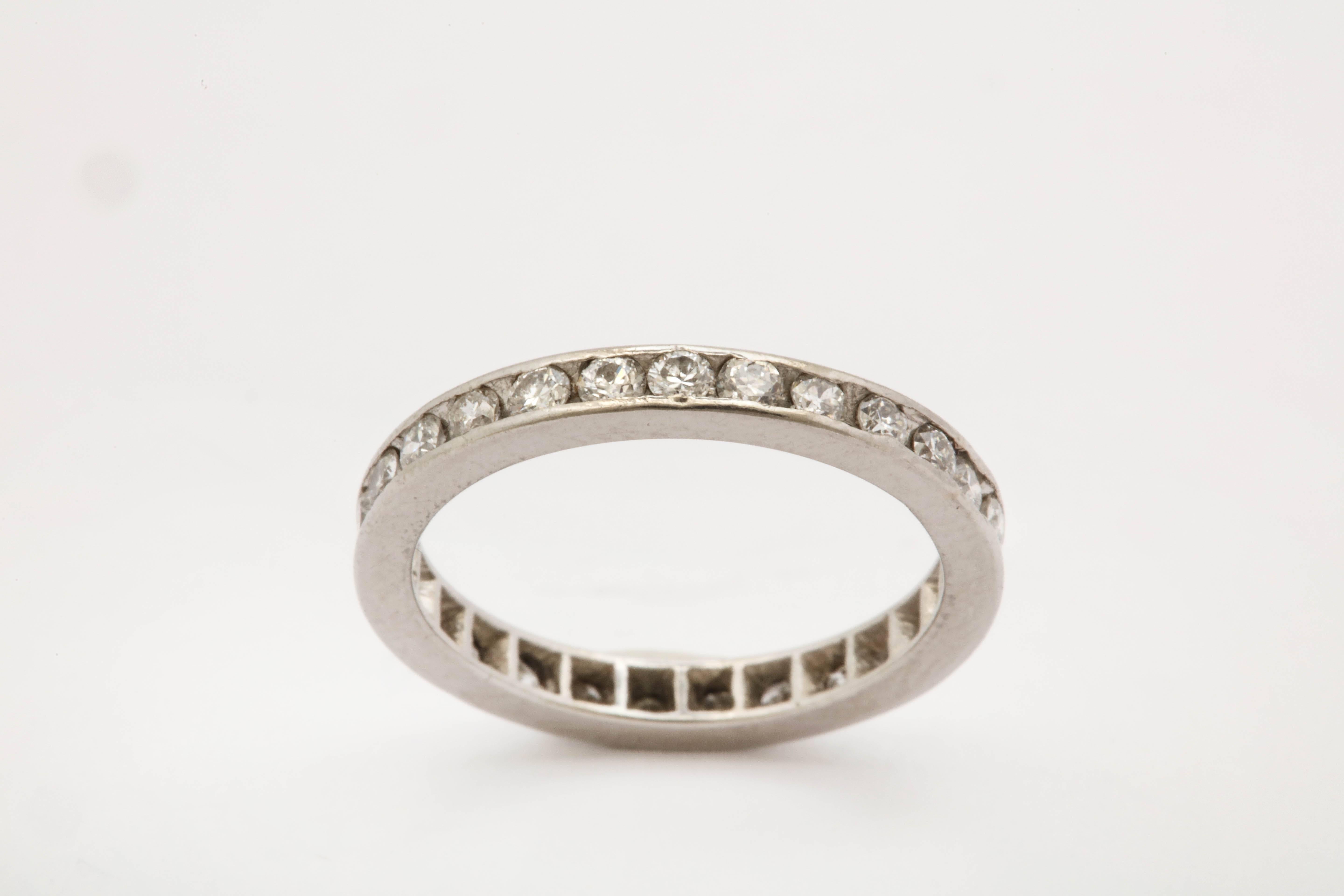 One Ladies Platinum Eternity Band Composed Of 29 Full Cut Diamonds Weighing Approximately .75cts Total Weight. Diamonds Are All Channel Set And Ring Size Is An American 5.5 . Designed In The 1940's In The United States.Width Is Approximately 2.5 MM.