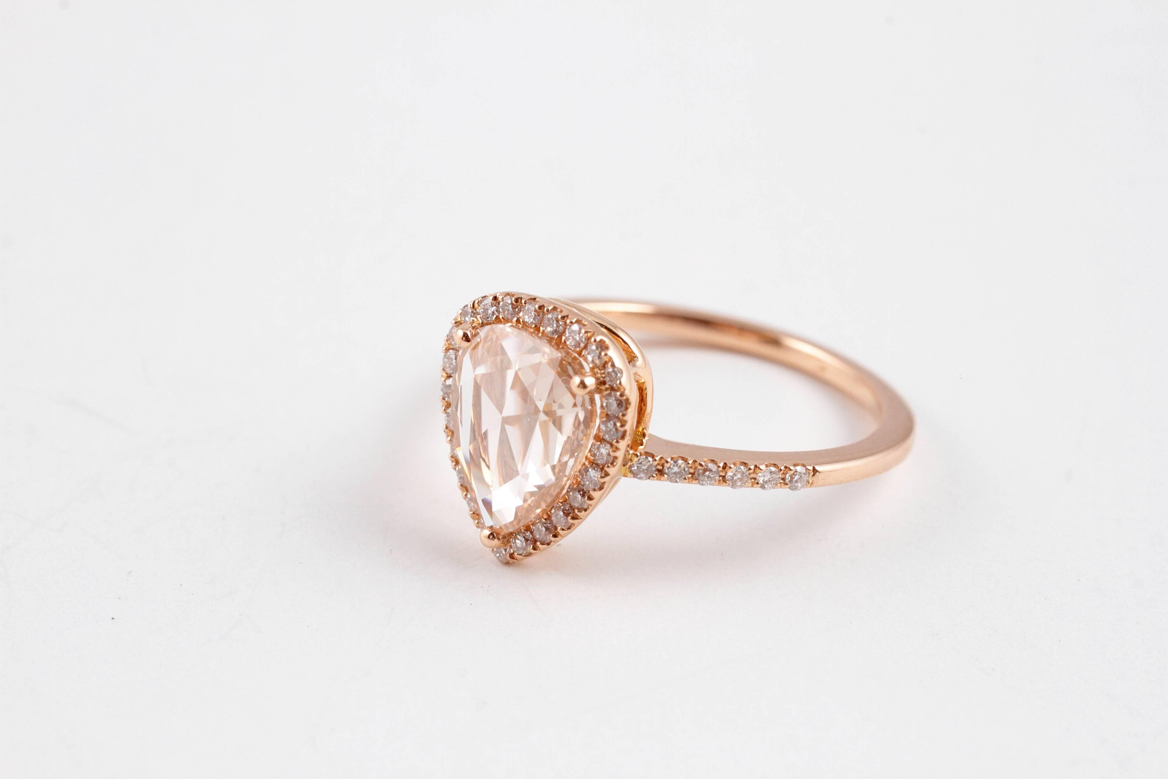 Warm rose gold for this lovely pear-shaped, rose-cut diamond, encircled by small diamonds.  Size 6 1/2.