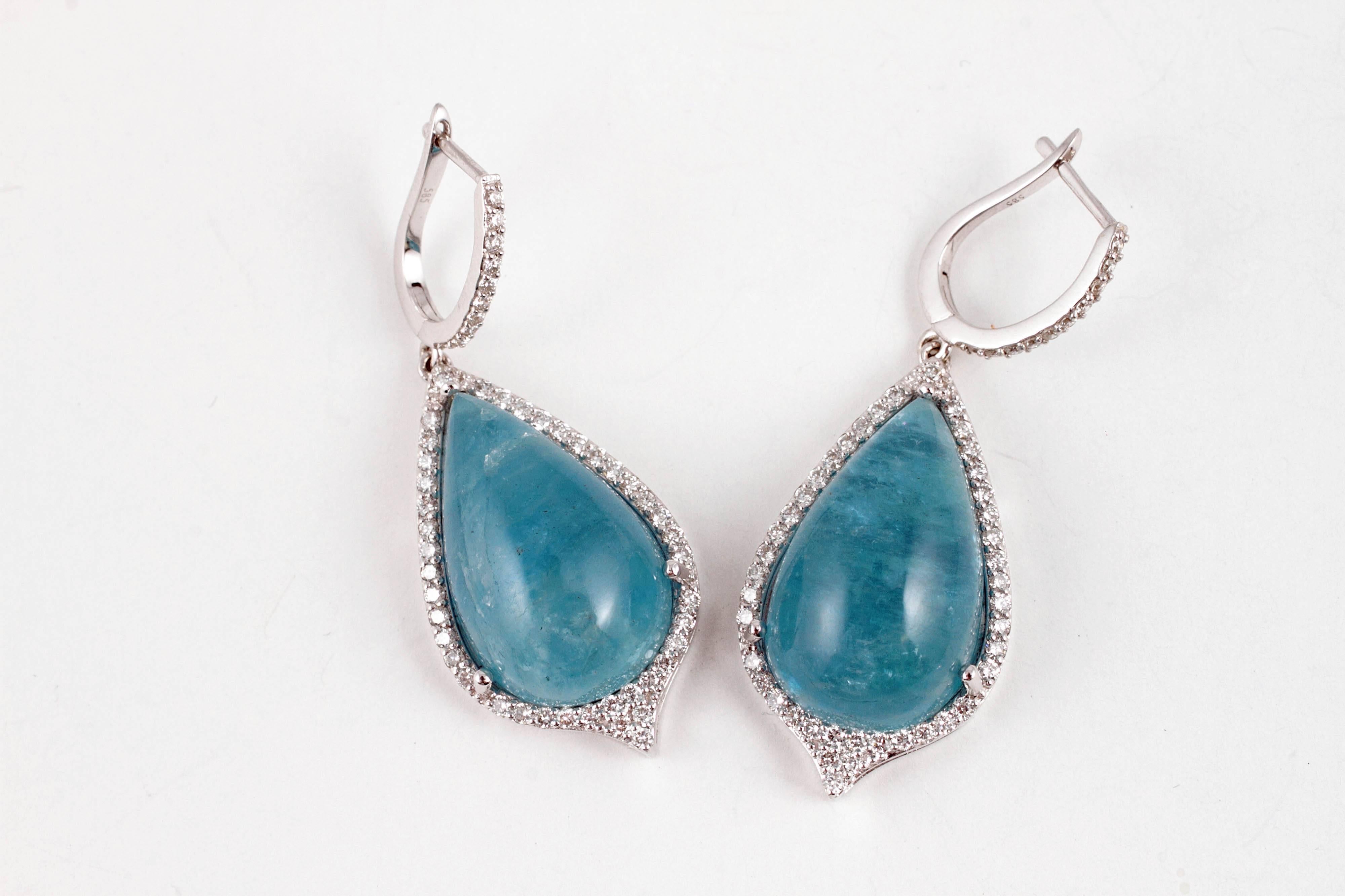 You would never guess how light these beauties are! In 14 karat white gold, with 1.75 total weight of diamonds around the cabochon-cut aquamarine stones.  The aqua's weigh approximately 30.00 carats total weight.  They are perfect!