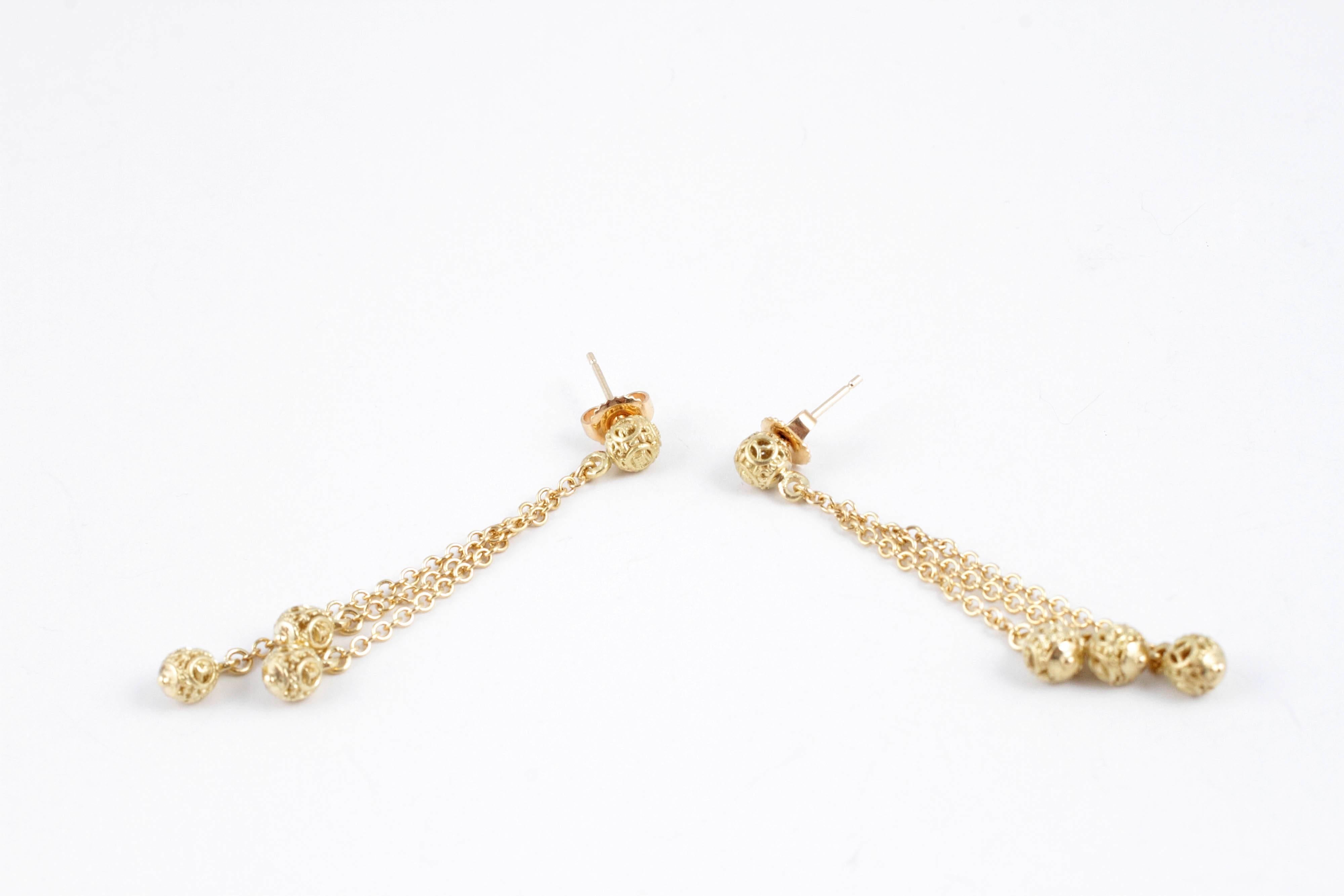 Swinging and Fun! In 14 karat, textured yellow gold, almost 2