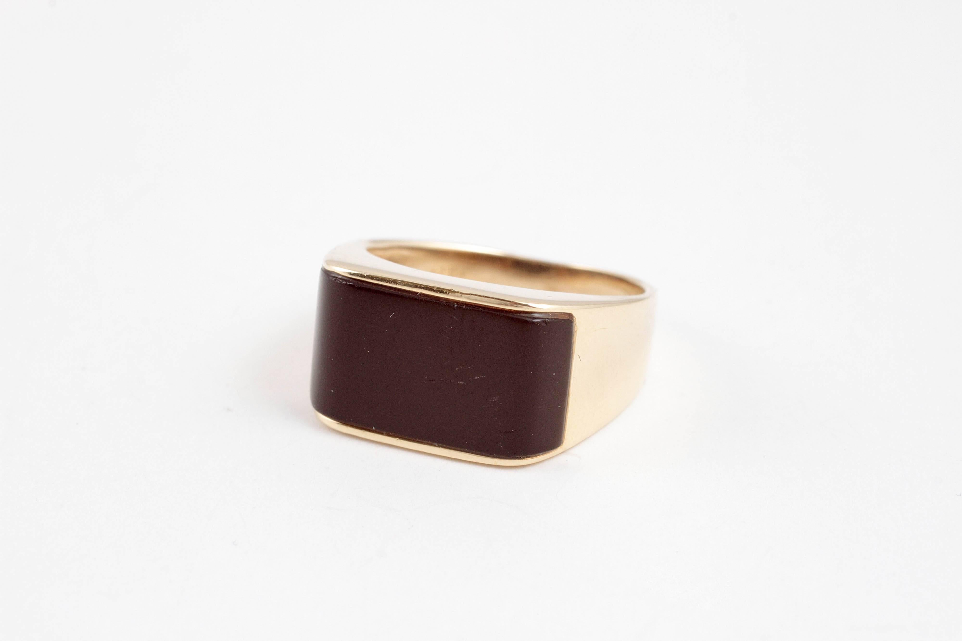 Clean and classic lines in 14 karat yellow gold, size 5 3/4. 